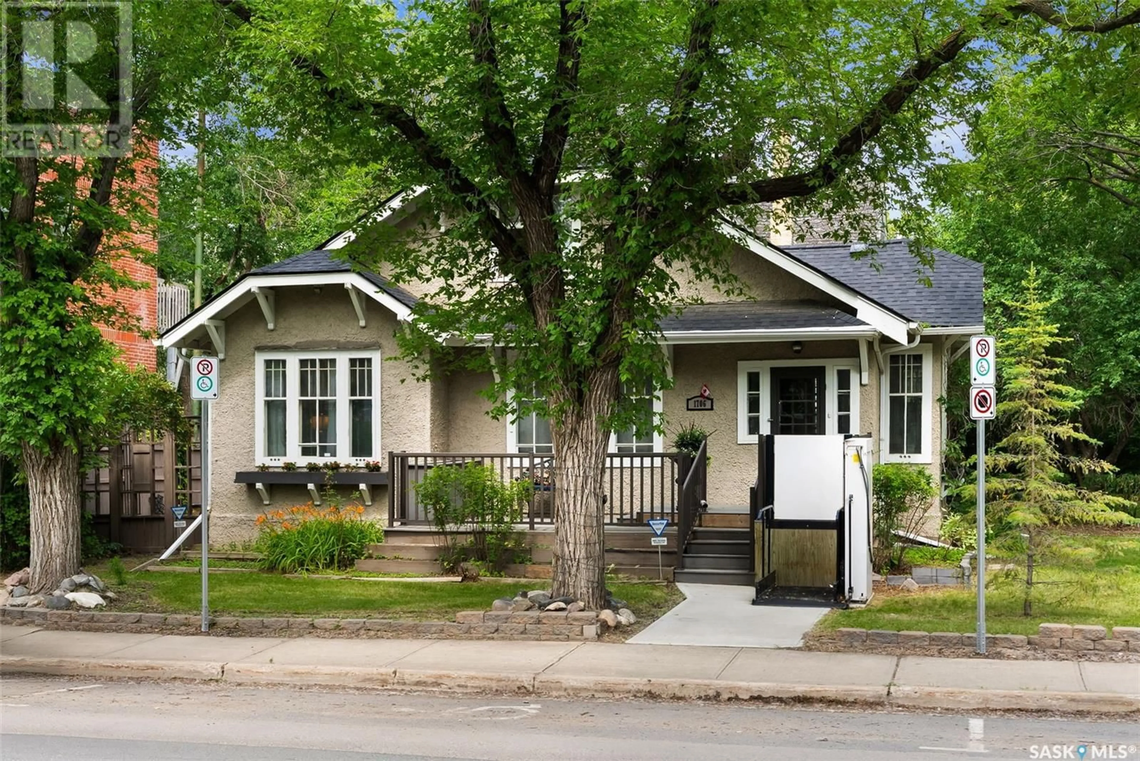 Home with vinyl exterior material, street for 1706 15TH AVENUE, Regina Saskatchewan S4P0Z7