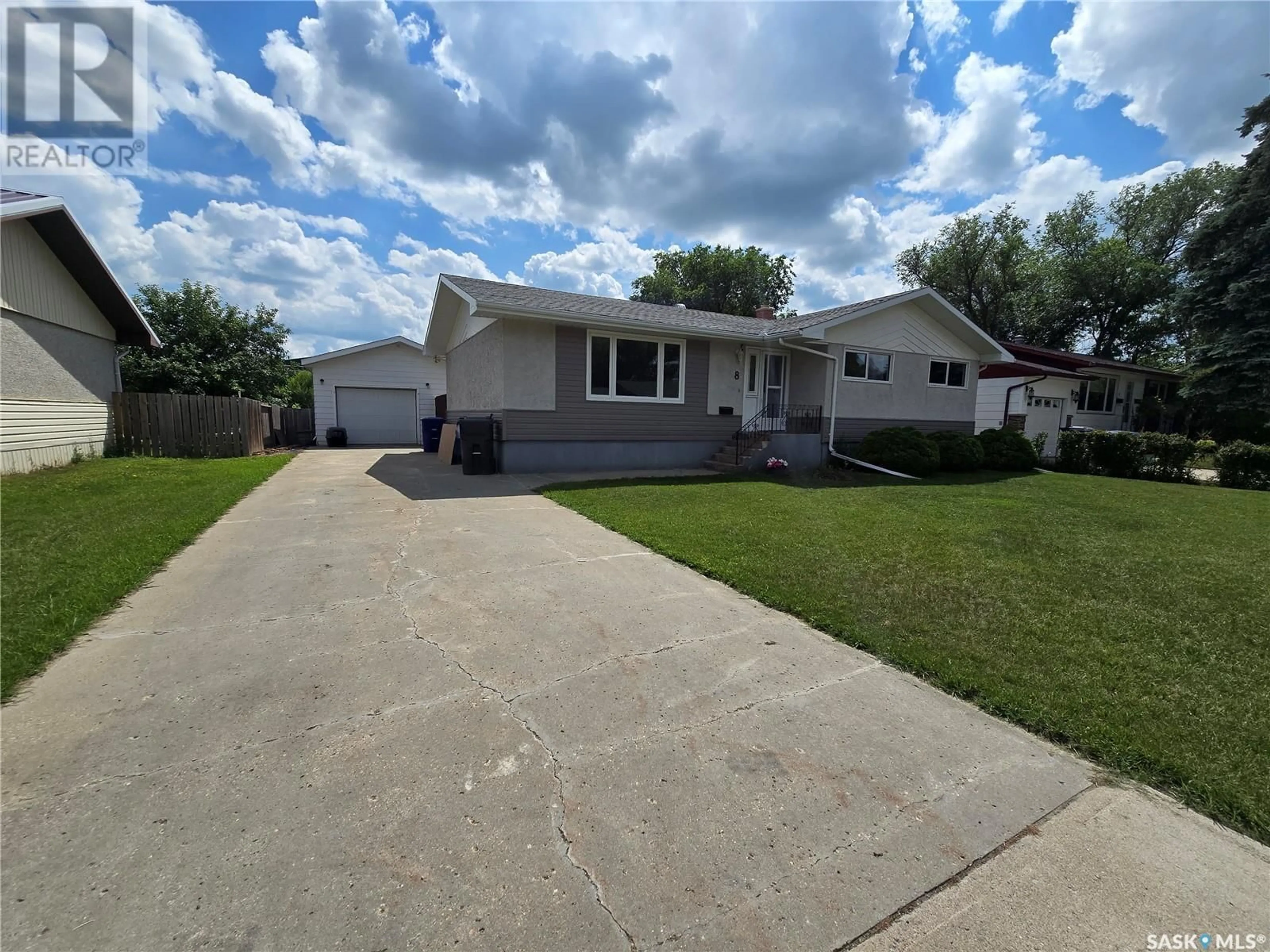 Home with vinyl exterior material, street for 8 HARTNEY BAY, Weyburn Saskatchewan S4H0M1