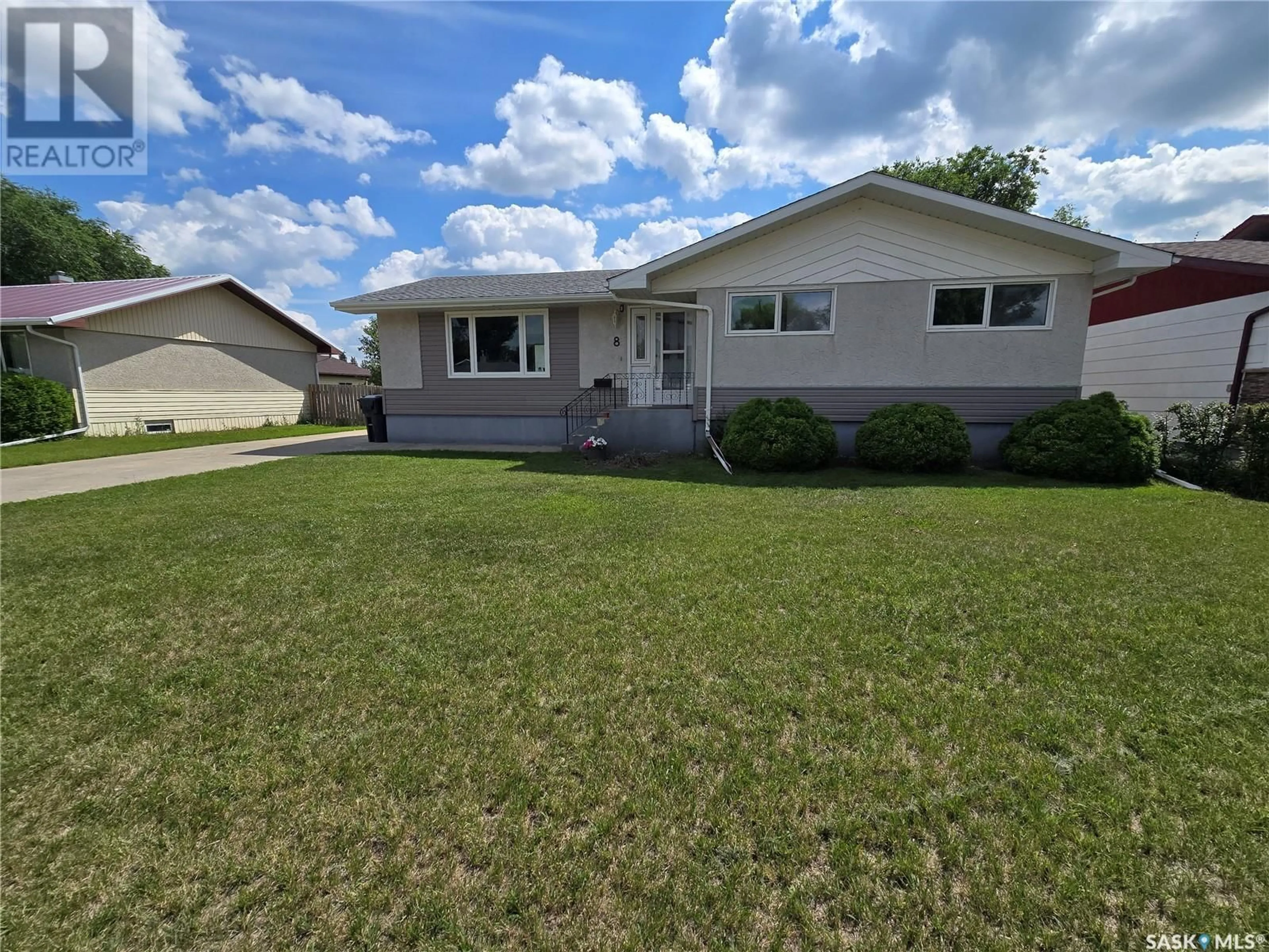 Home with vinyl exterior material, street for 8 HARTNEY BAY, Weyburn Saskatchewan S4H0M1