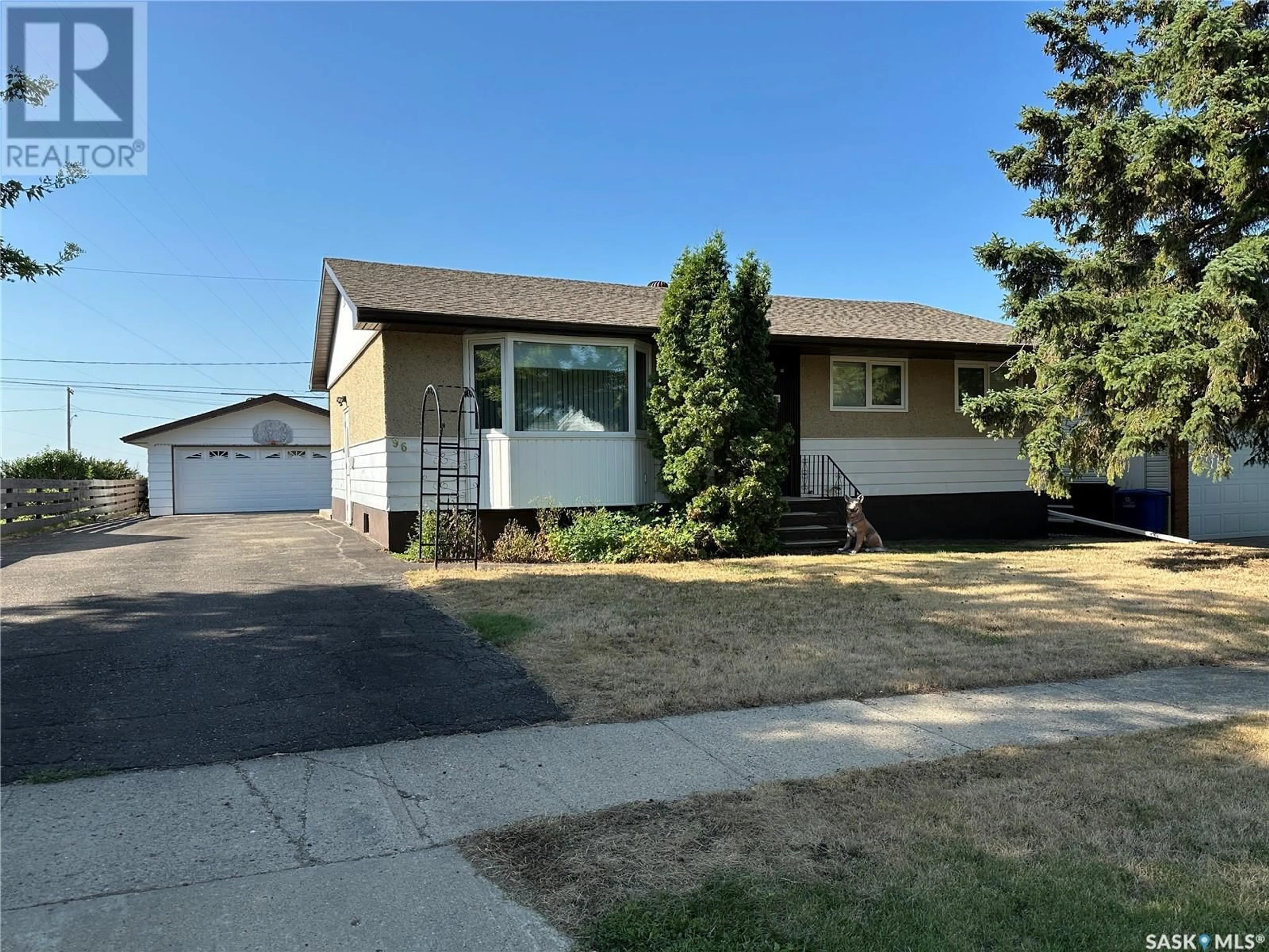 Home with vinyl exterior material, street for 96 9TH AVENUE, Weyburn Saskatchewan S4H1Z7