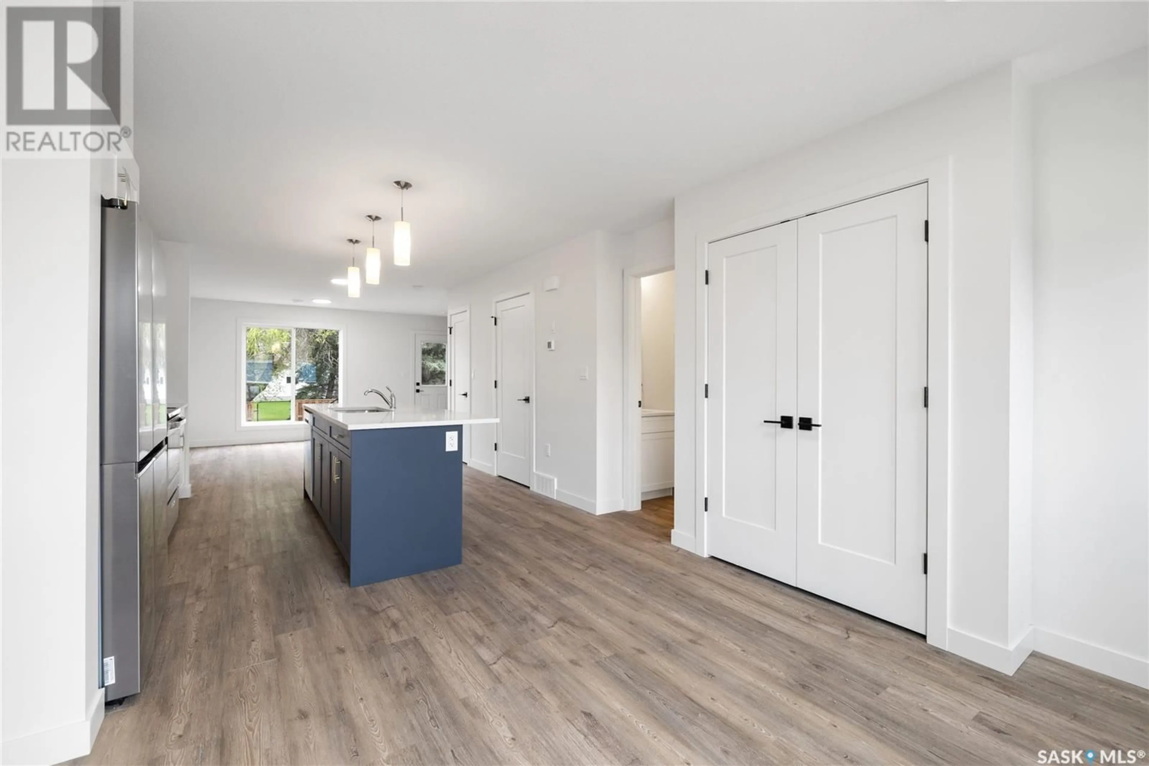 Open concept kitchen, wood/laminate floor for 4 A/B - 75 3RD AVENUE, Lumsden Saskatchewan S0G3C0
