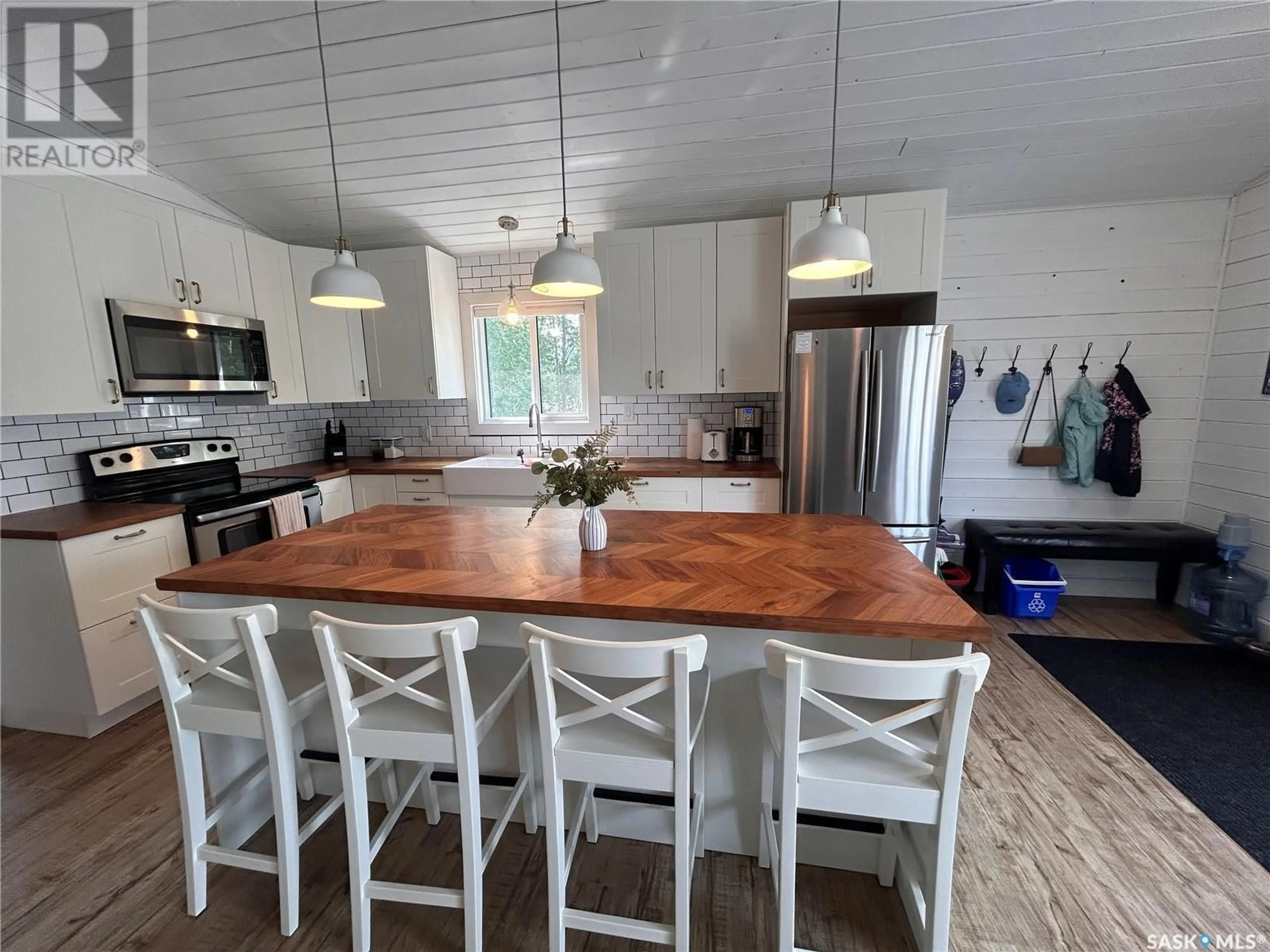 Open concept kitchen, wood/laminate floor for 16 KEN CRESCENT, Candle Lake Saskatchewan S0J3E0