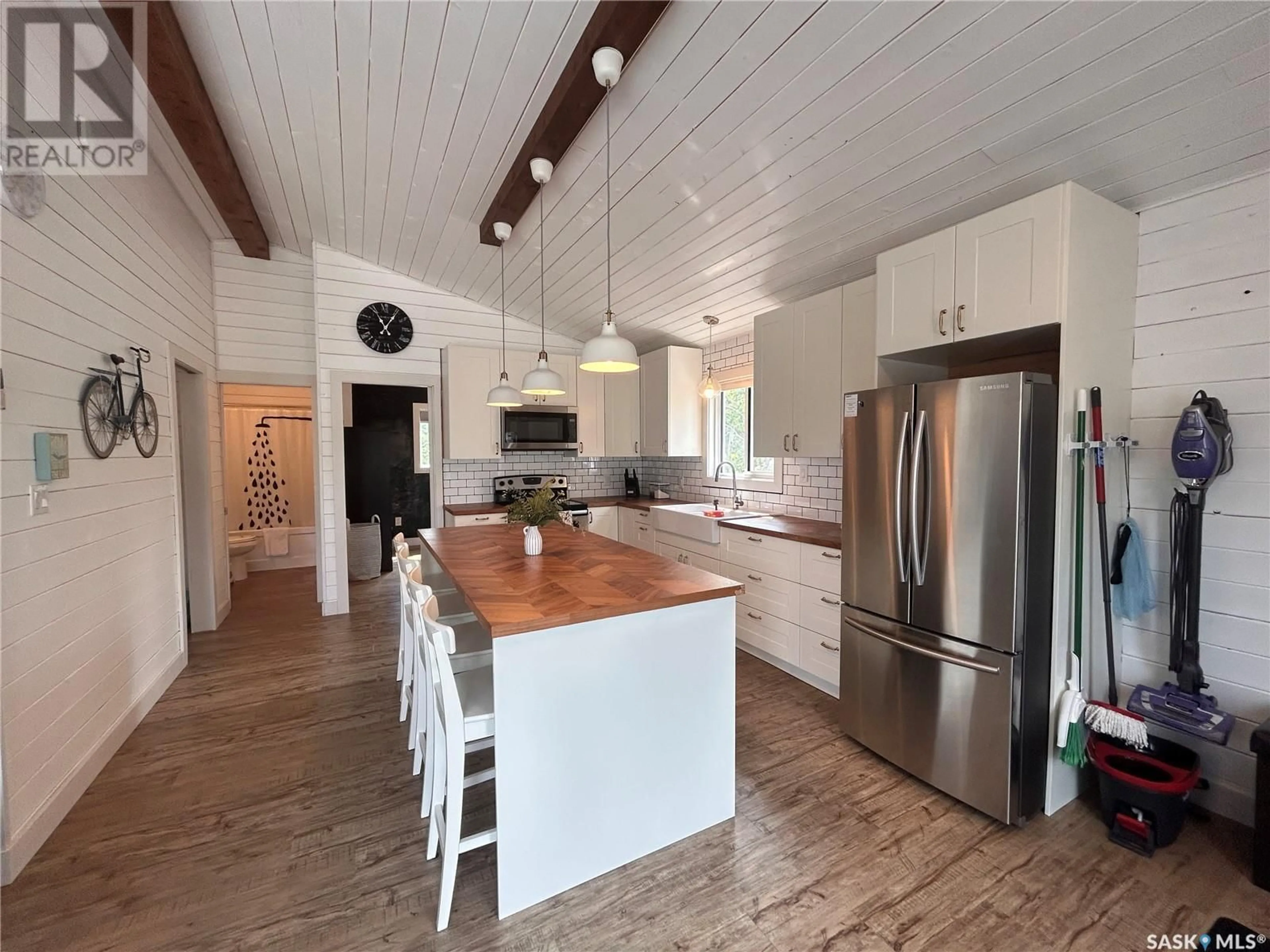 Open concept kitchen, wood/laminate floor for 16 KEN CRESCENT, Candle Lake Saskatchewan S0J3E0
