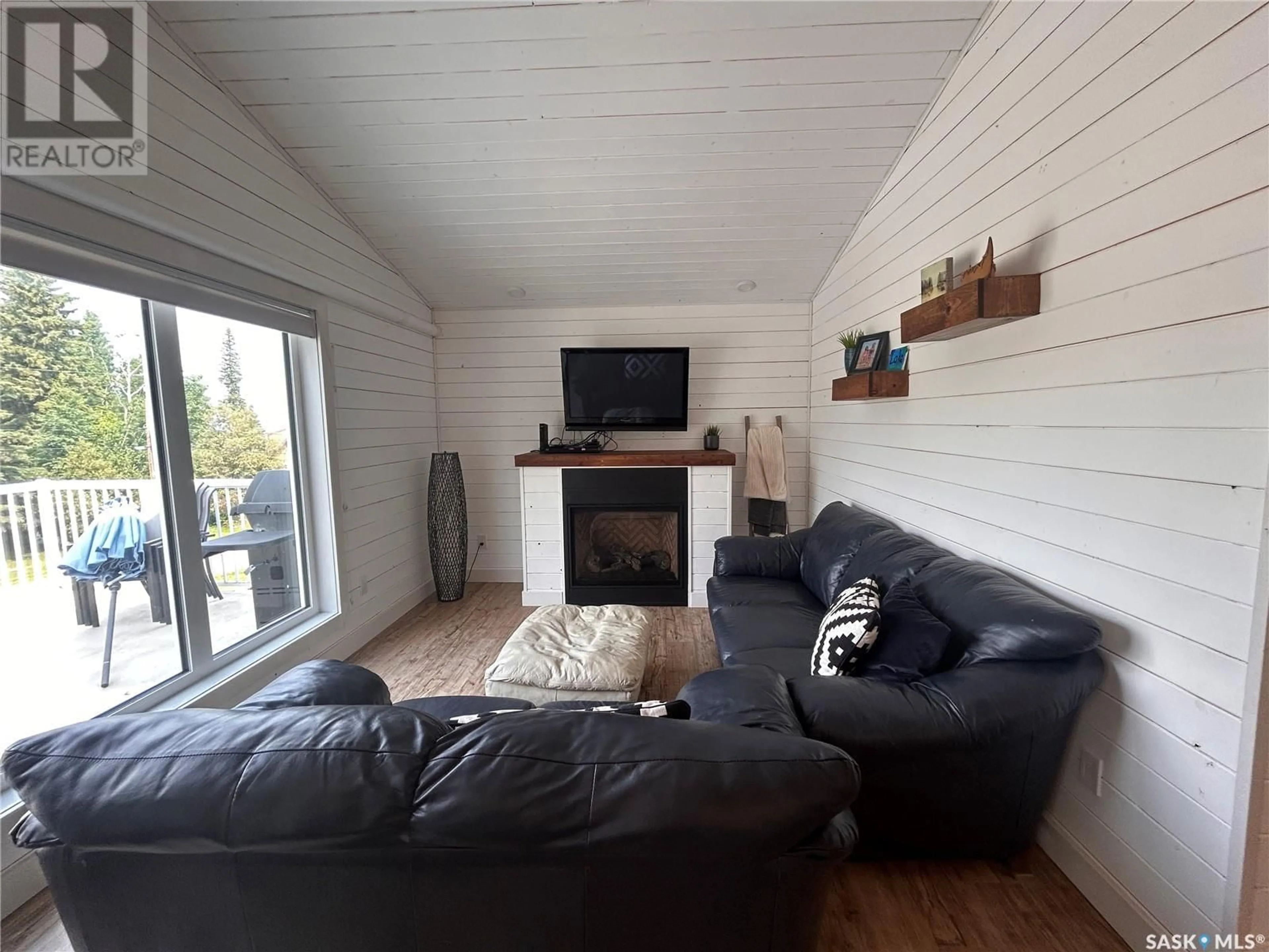 Living room with furniture, wood/laminate floor for 16 KEN CRESCENT, Candle Lake Saskatchewan S0J3E0