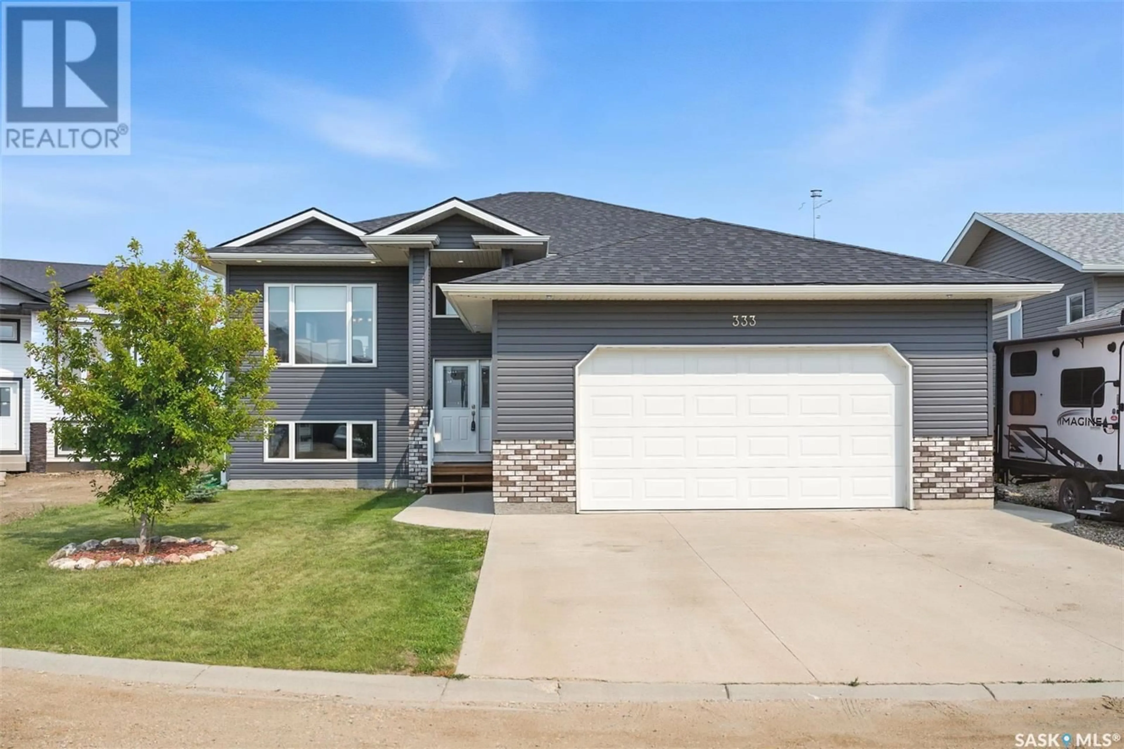 Home with vinyl exterior material, street for 333 HAMM COURT, Aberdeen Saskatchewan S0K0A0