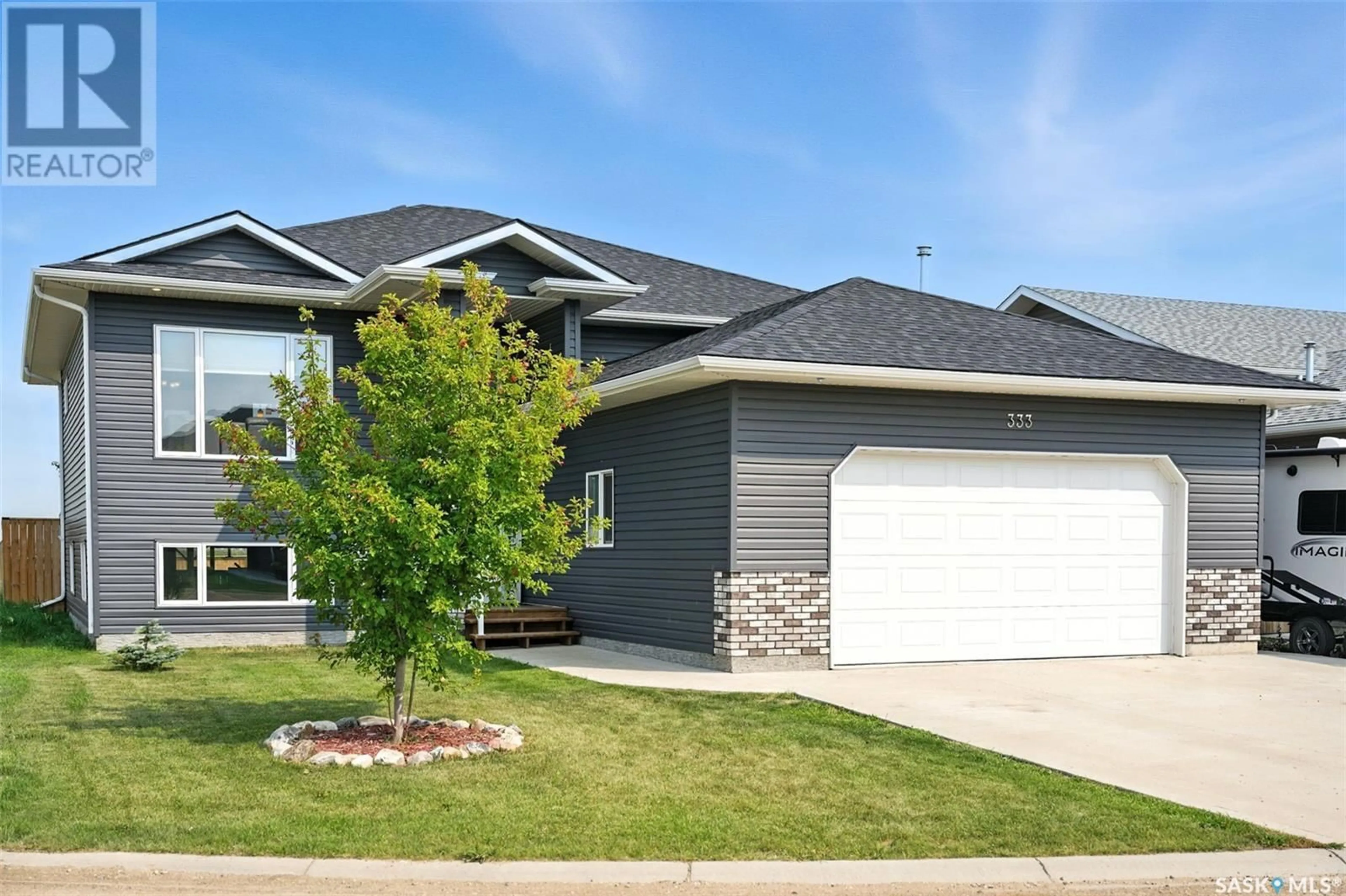 Home with vinyl exterior material, street for 333 HAMM COURT, Aberdeen Saskatchewan S0K0A0