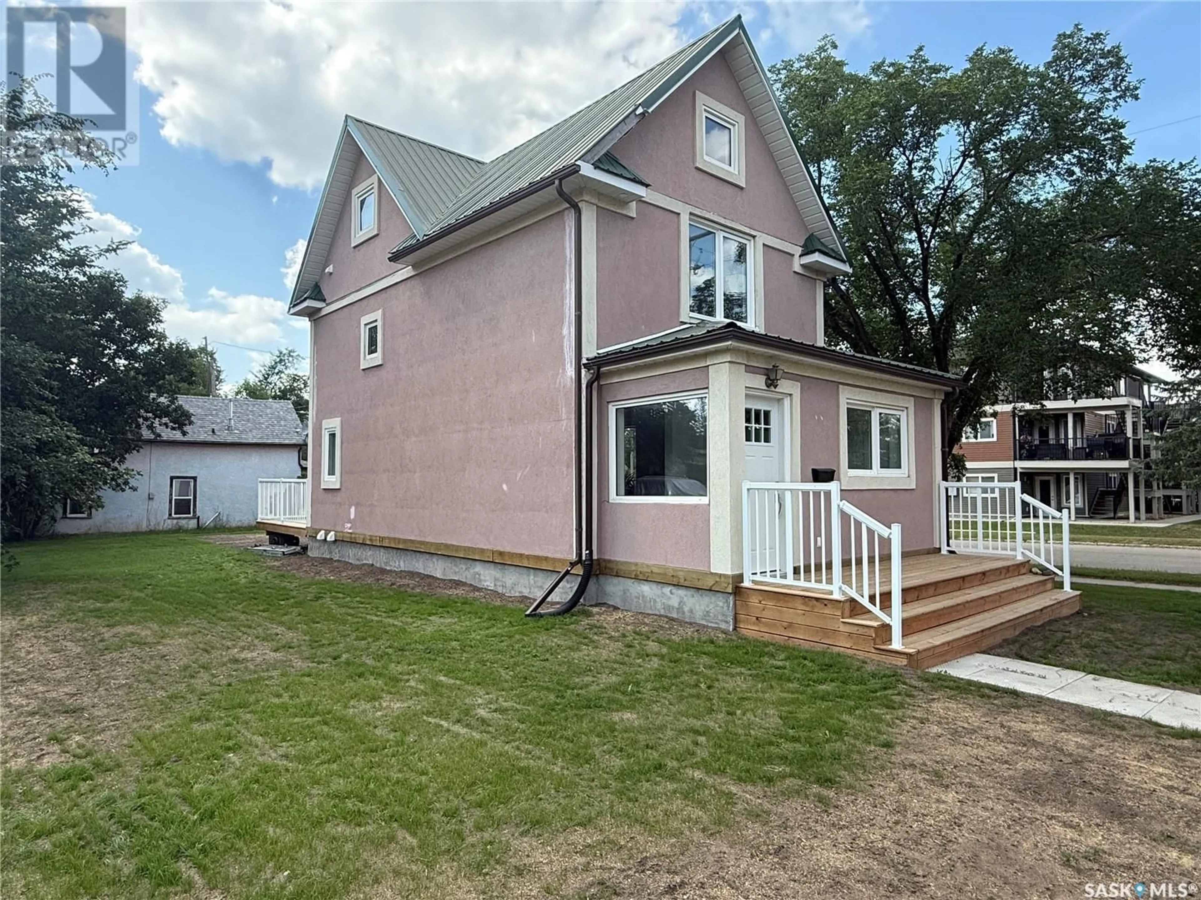 Home with vinyl exterior material, street for 301 3RD STREET, Weyburn Saskatchewan S4H2C5
