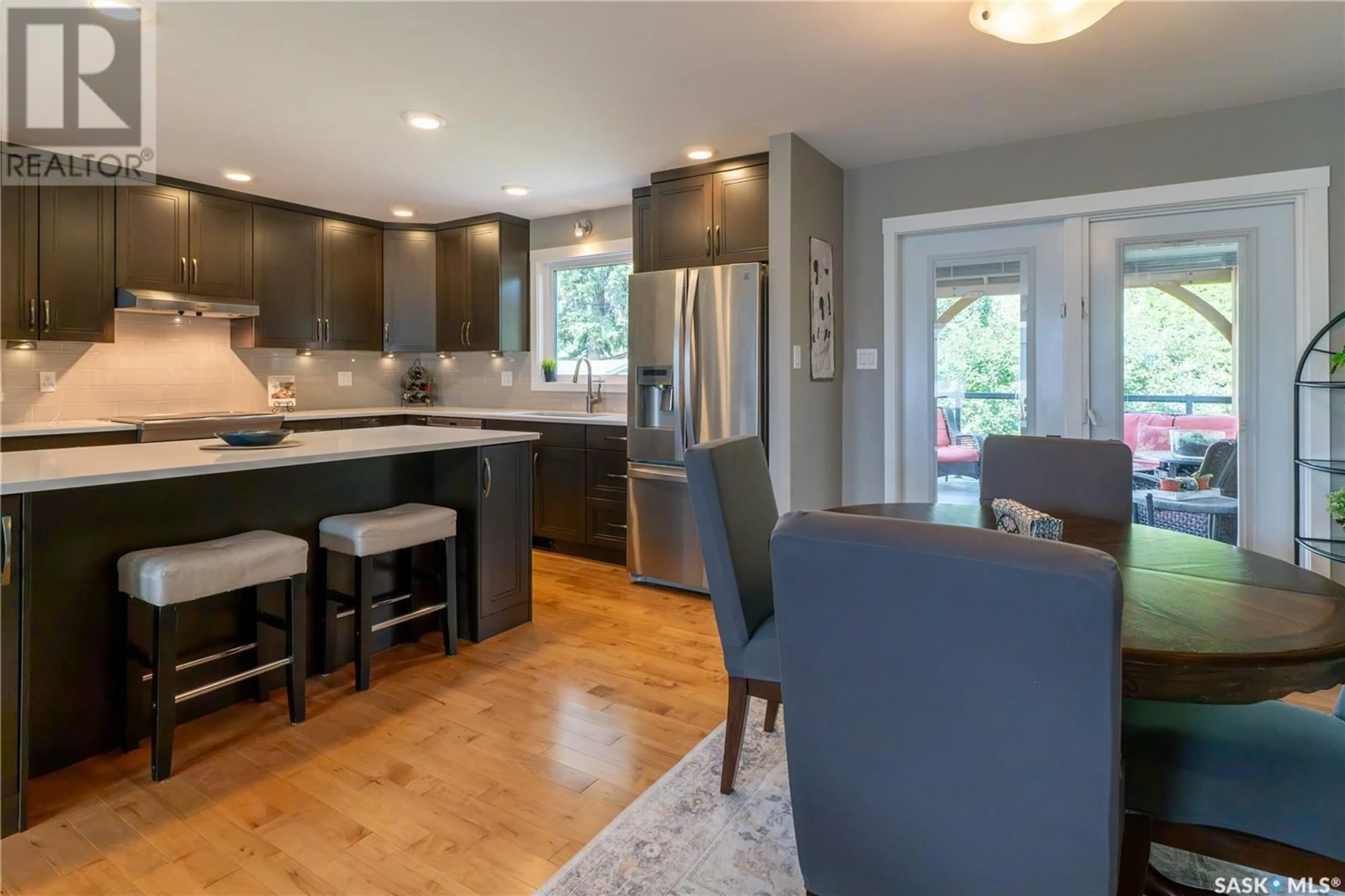 Open concept kitchen, wood/laminate floor for 110 ROBORECKI CRESCENT, Saskatoon Saskatchewan S7K5K9