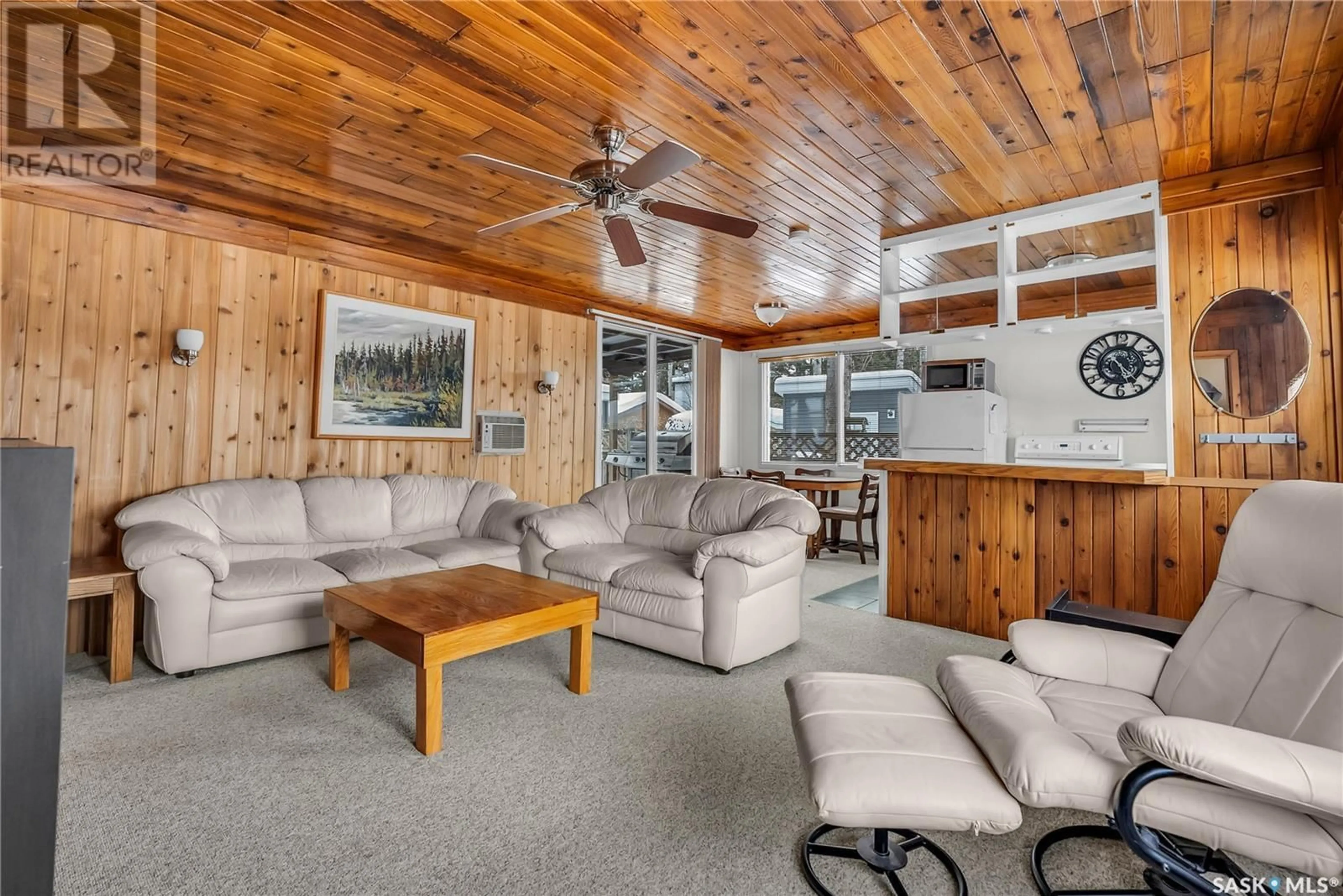 Living room with furniture, wood/laminate floor for 30 6TH STREET, Lakeland Rm No. 521 Saskatchewan S0J0N0