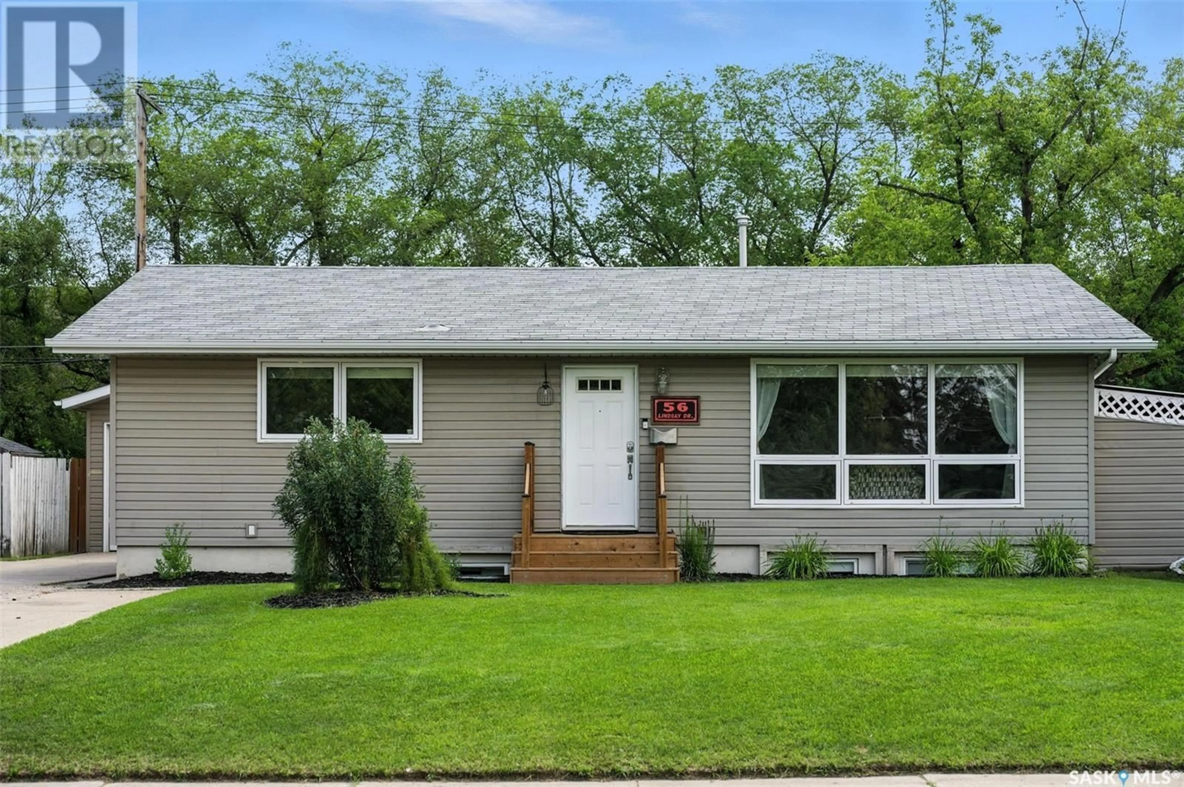 Home with vinyl exterior material, street for 56 LINDSAY DRIVE, Saskatoon Saskatchewan S7H3E1