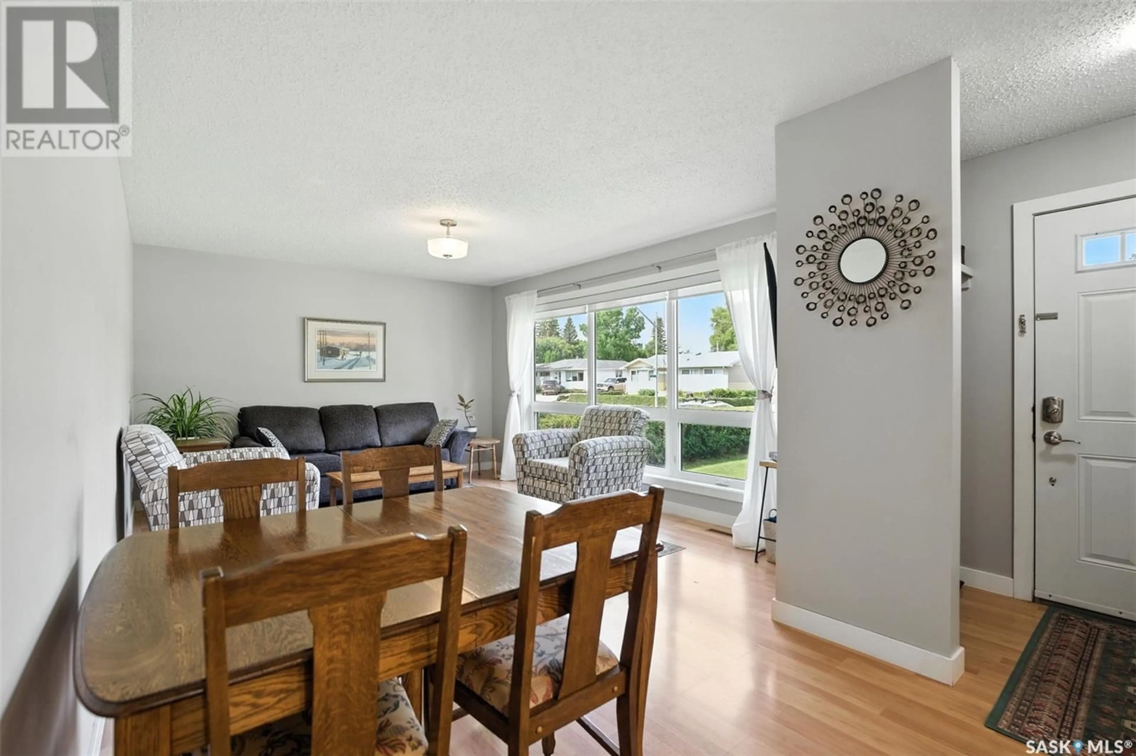 Dining room, wood/laminate floor for 56 LINDSAY DRIVE, Saskatoon Saskatchewan S7H3E1