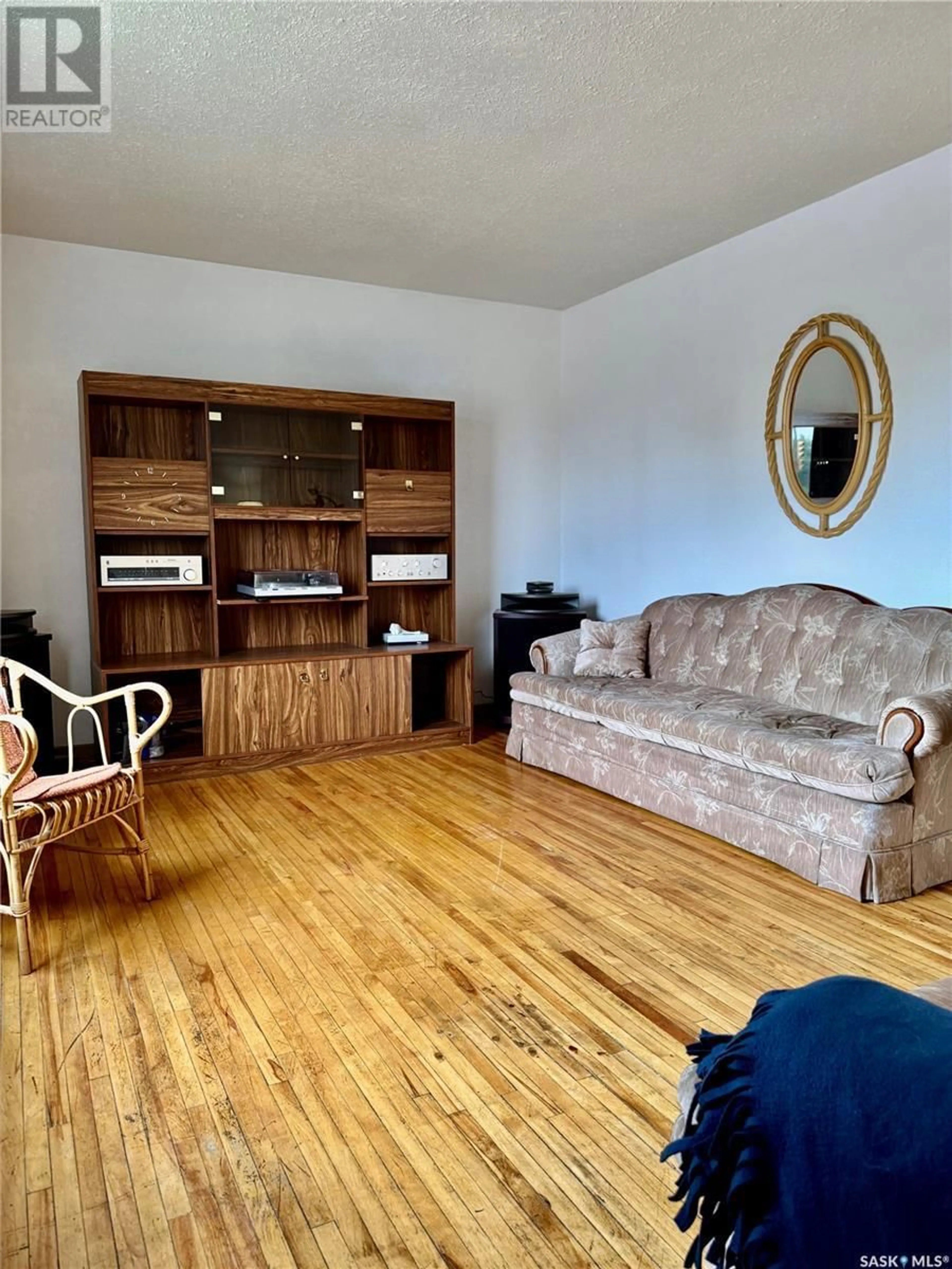 Living room with furniture, wood/laminate floor for 597 RIVER STREET, Prince Albert Saskatchewan S6V2J2