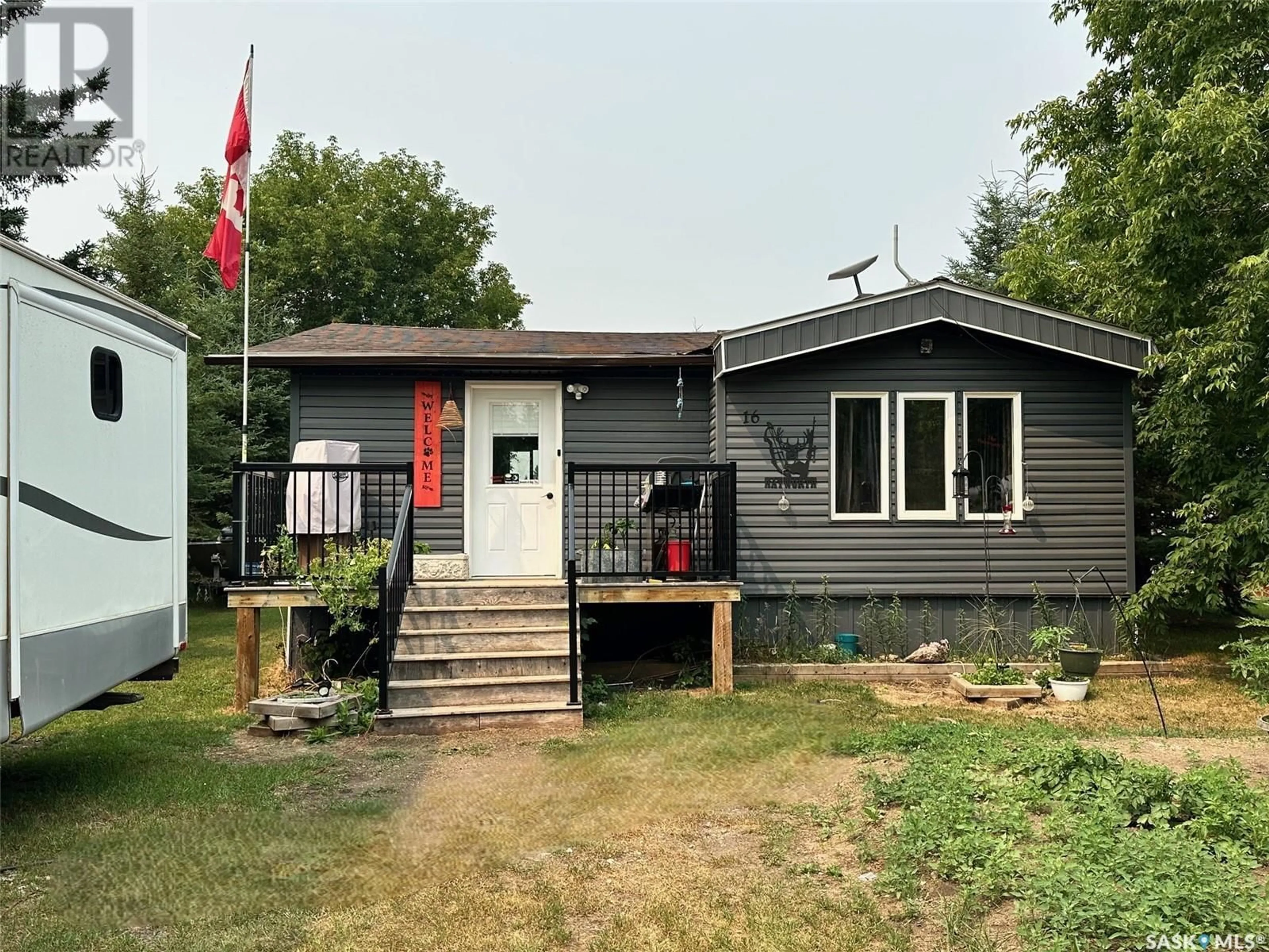 Home with vinyl exterior material, street for 16 MAIN STREET, Hudson Bay Saskatchewan S0E0Y0