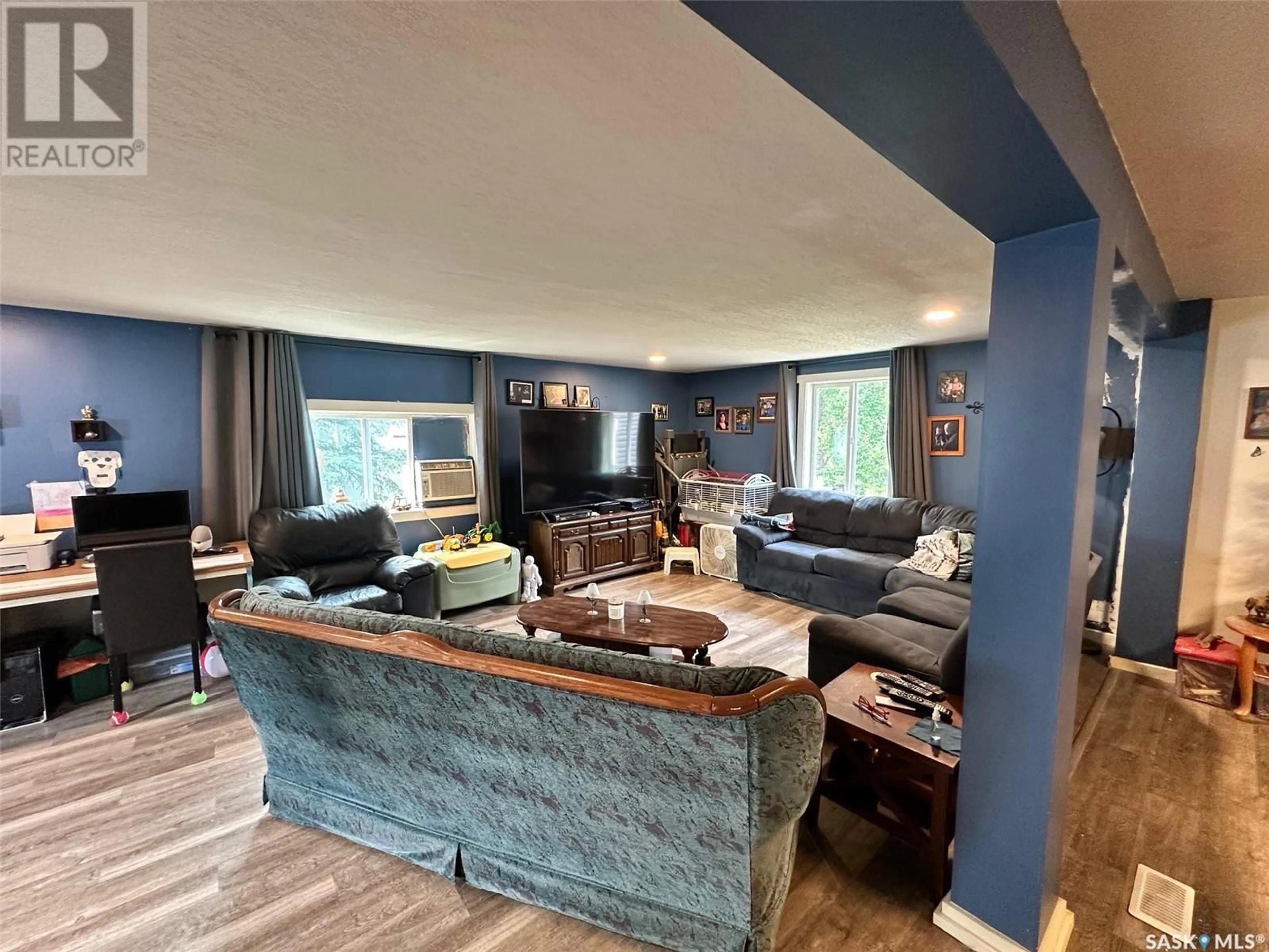 Living room with furniture, wood/laminate floor for 16 MAIN STREET, Hudson Bay Saskatchewan S0E0Y0