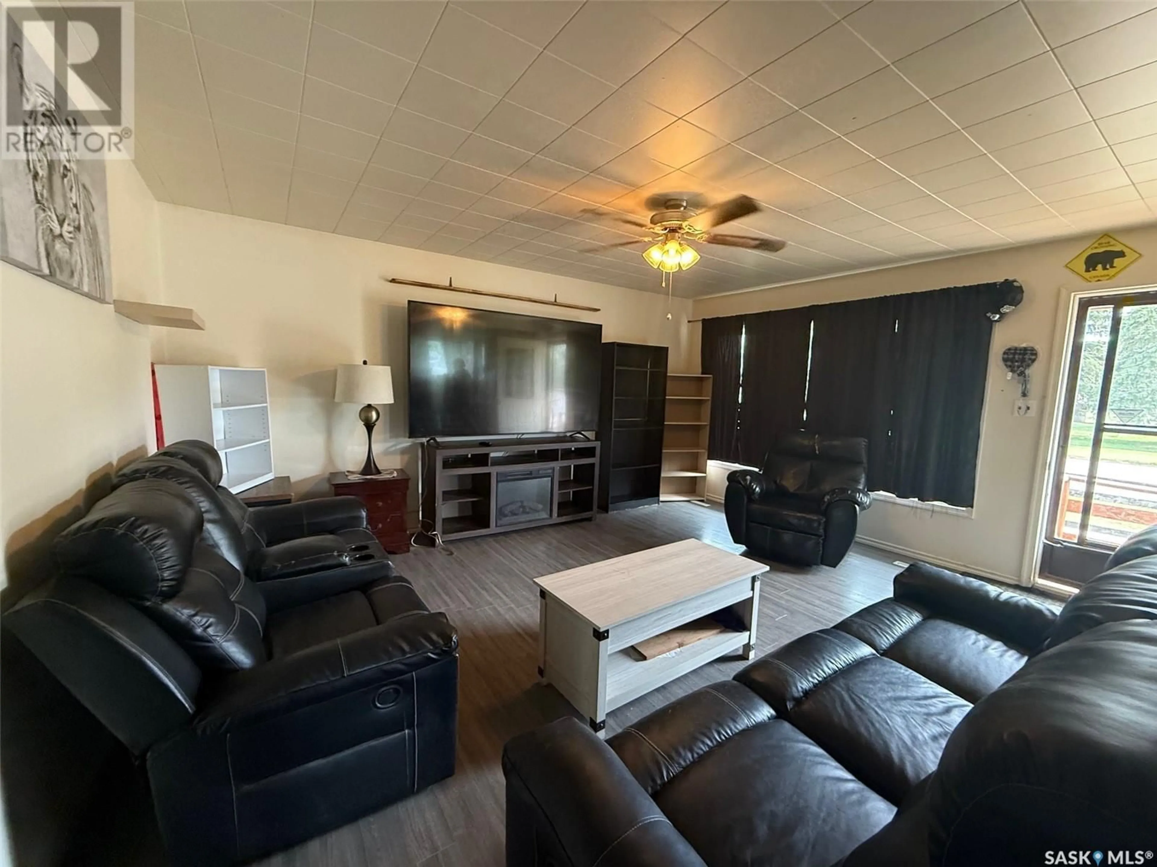 Living room with furniture, wood/laminate floor for 1726 15TH STREET, Prince Albert Saskatchewan S6V3T5