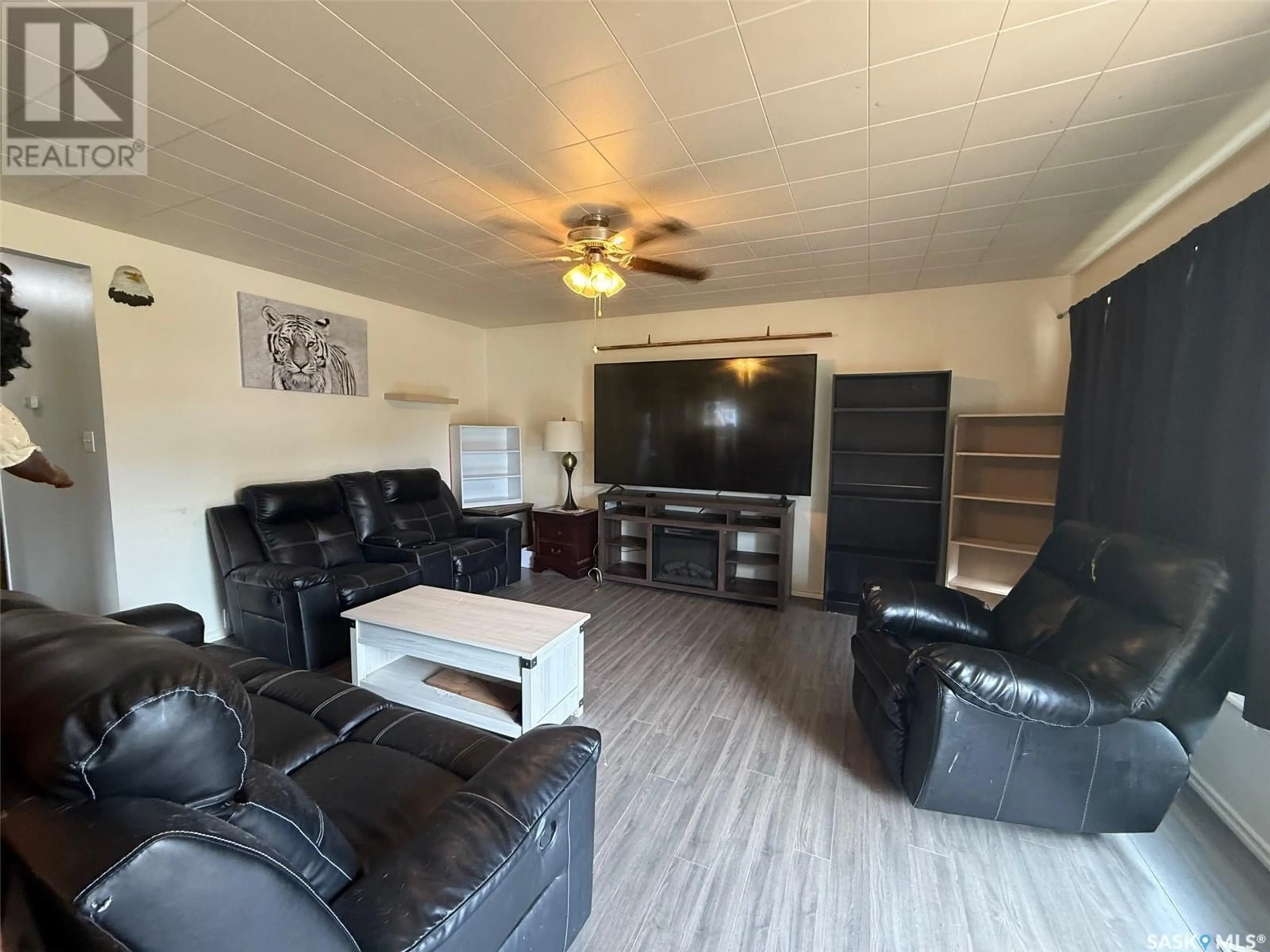 Living room with furniture, wood/laminate floor for 1726 15TH STREET, Prince Albert Saskatchewan S6V3T5