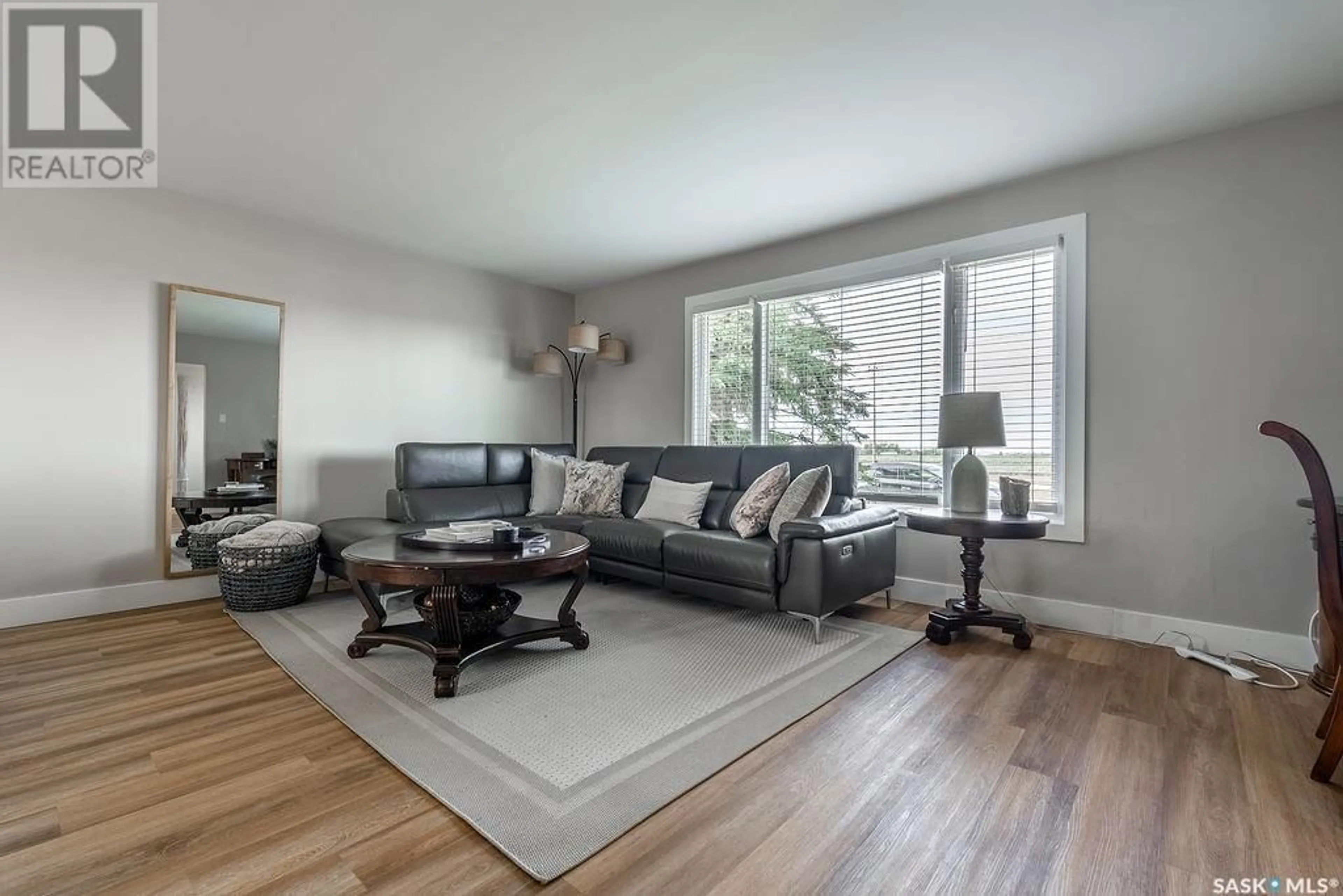Living room with furniture, wood/laminate floor for 2608 14TH STREET, Saskatoon Saskatchewan S7H0B3