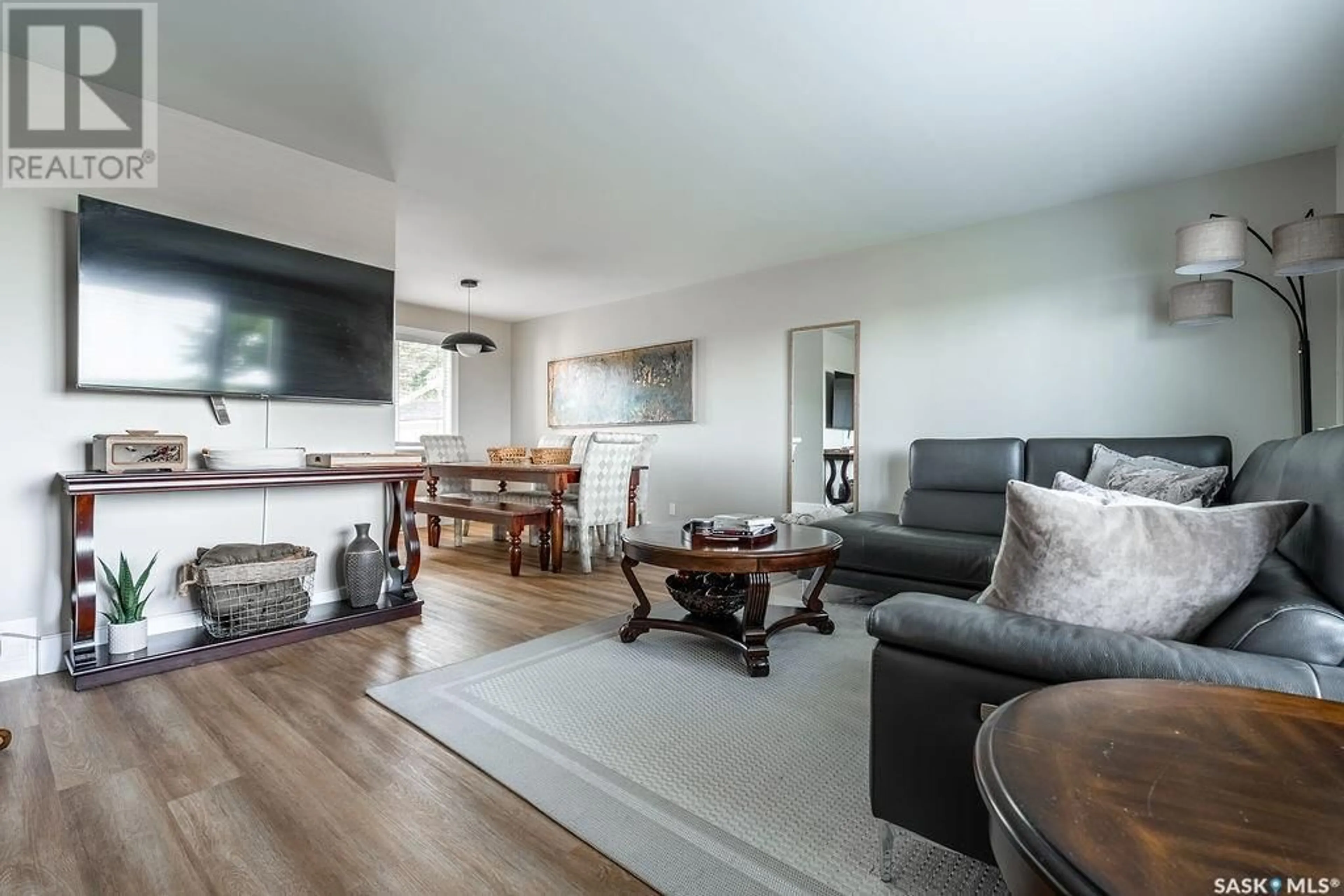 Living room with furniture, wood/laminate floor for 2608 14TH STREET, Saskatoon Saskatchewan S7H0B3