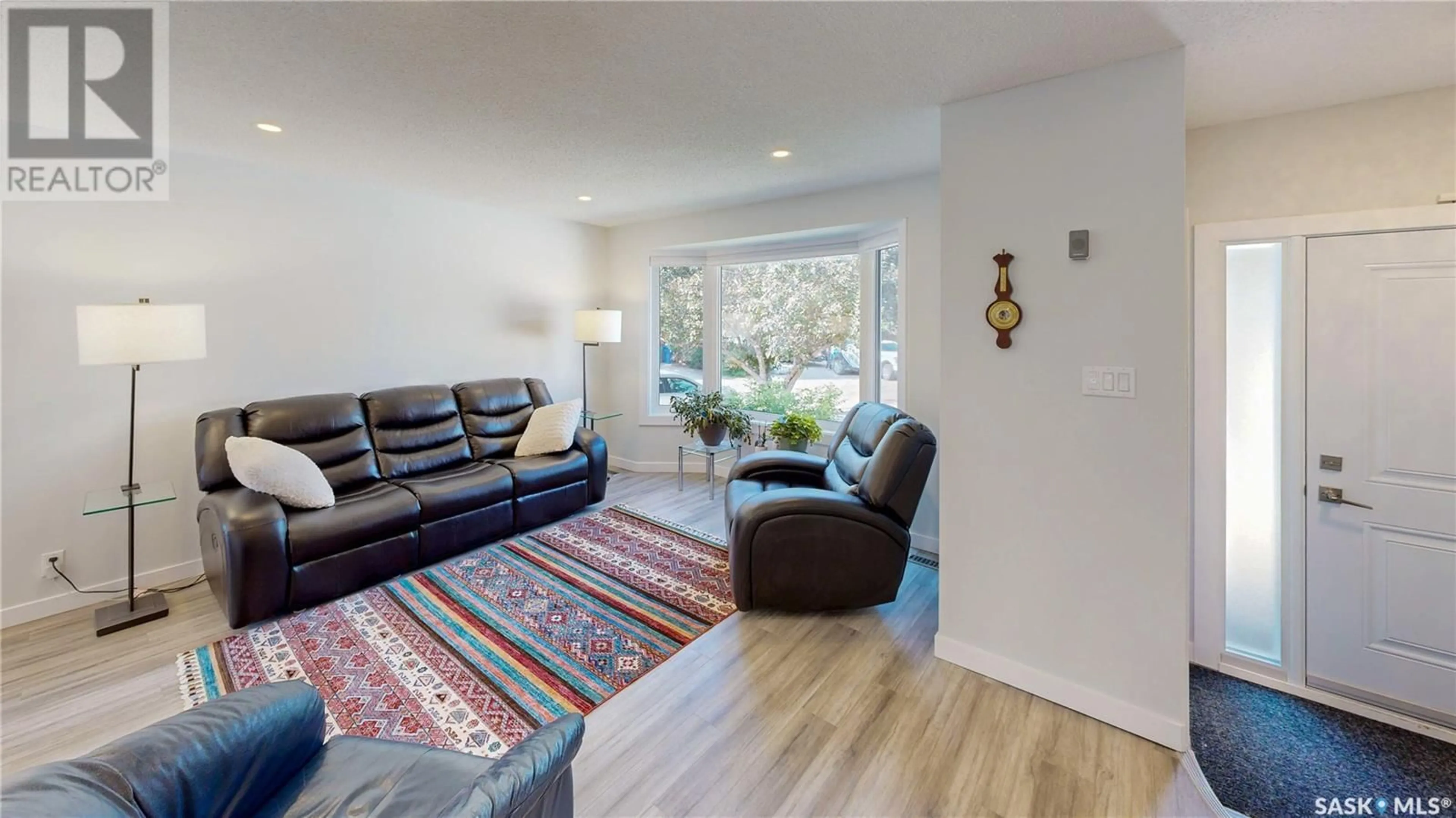 Living room with furniture, wood/laminate floor for 1738 SINCLAIR STREET, Regina Saskatchewan S4V1G9