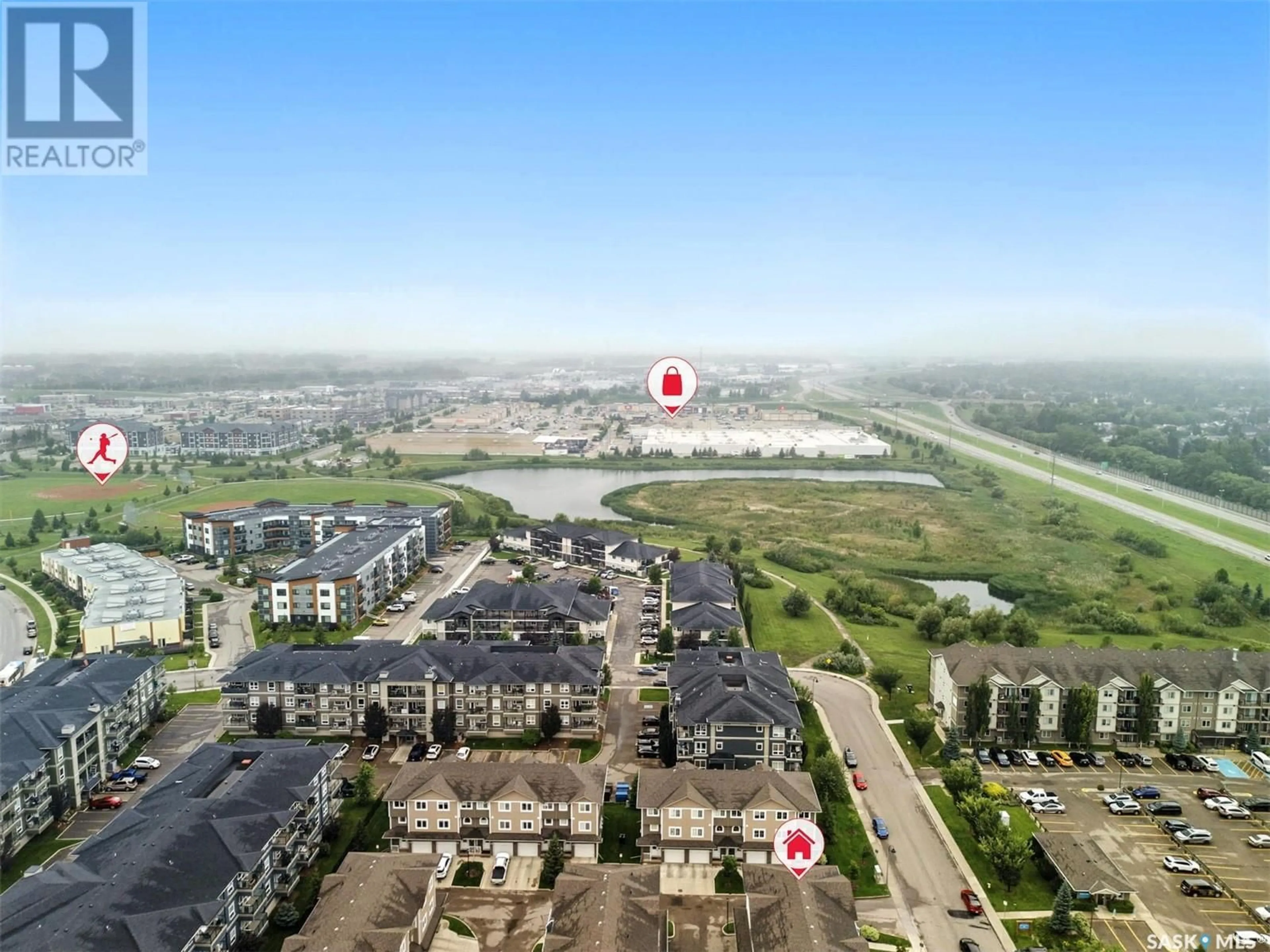A pic from outside/outdoor area/front of a property/back of a property/a pic from drone, water/lake/river/ocean view for 212 - 202 WILLIS CRESCENT, Saskatoon Saskatchewan S7T0R7