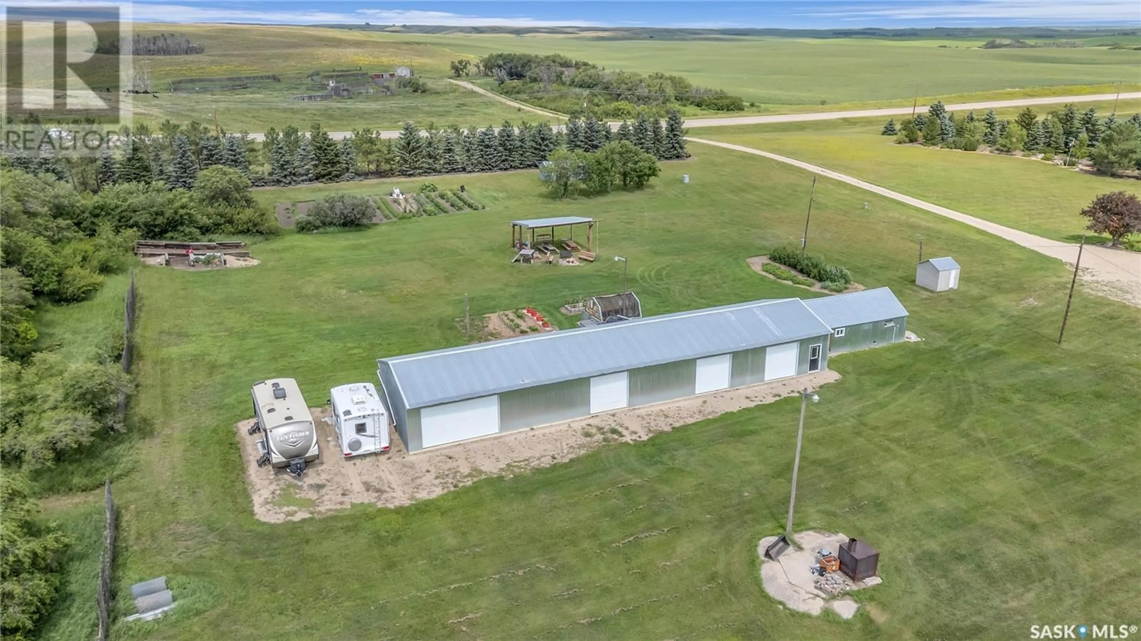 A pic from outside/outdoor area/front of a property/back of a property/a pic from drone, building for SAPSFORD ACREAGE, Perdue Rm No. 346 Saskatchewan S0K3C0