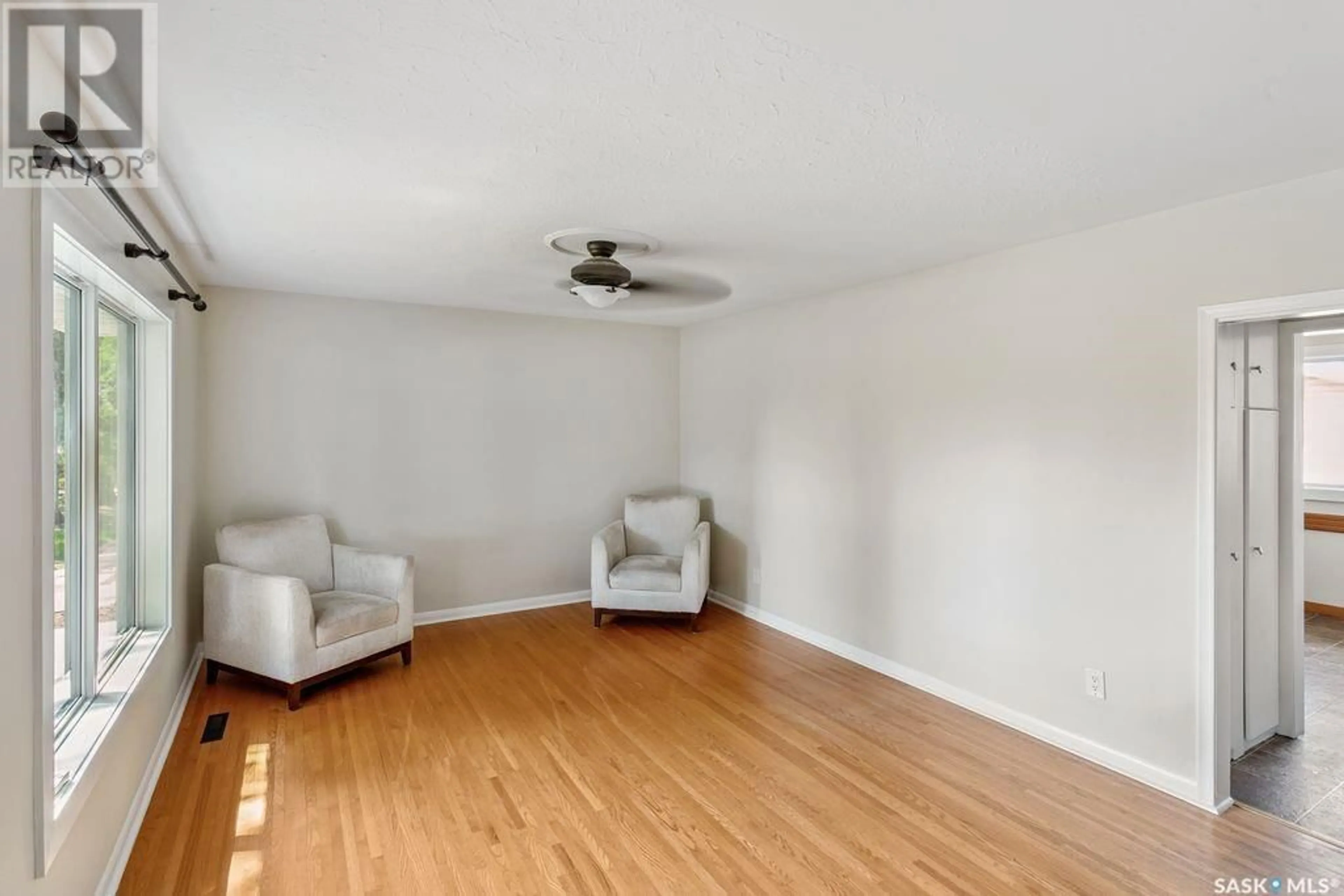 Living room with furniture, wood/laminate floor for 333 ADELAIDE STREET E, Saskatoon Saskatchewan S7J0H8