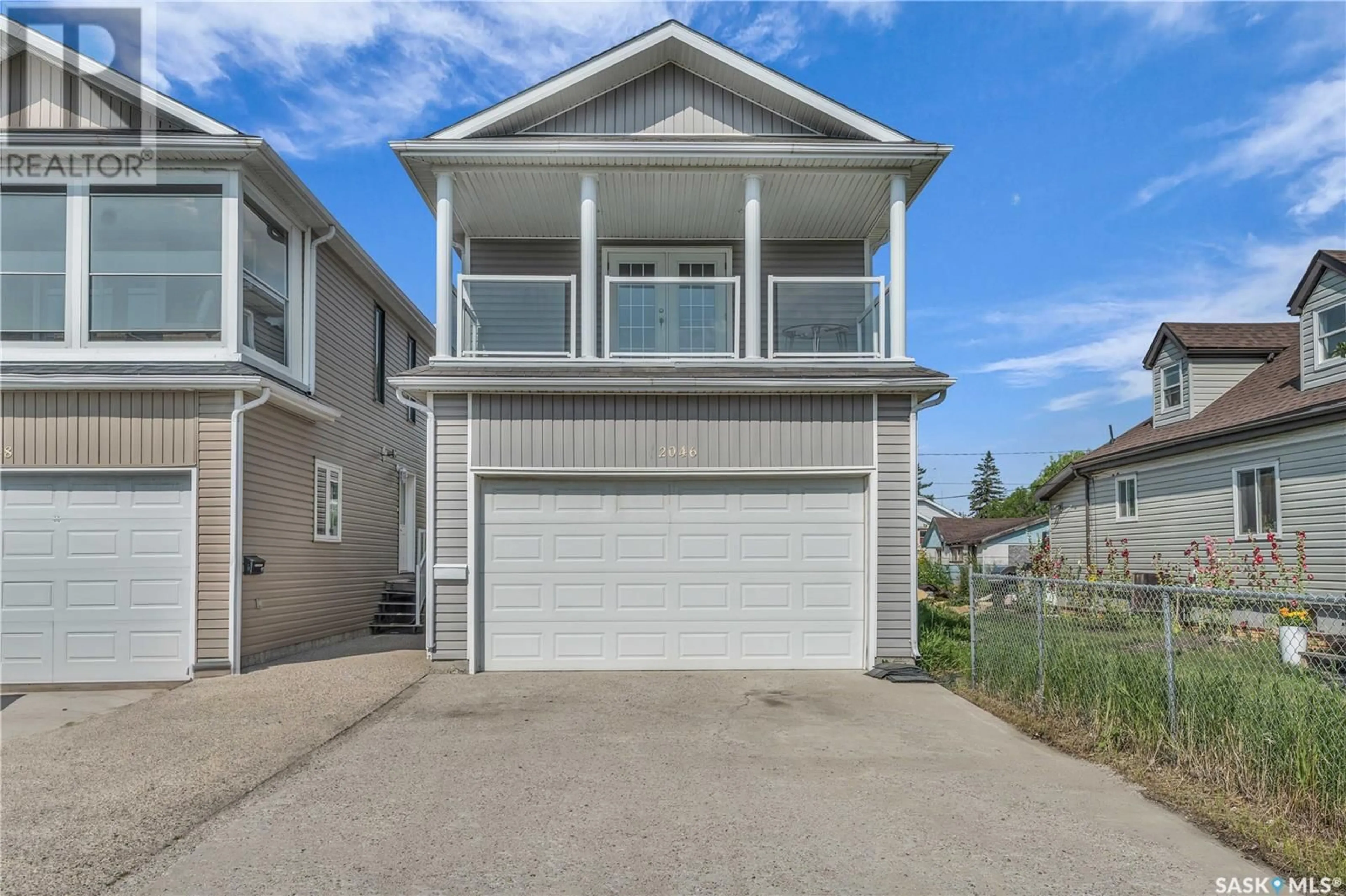 Home with vinyl exterior material, street for 2046 ALEXANDRA STREET, Regina Saskatchewan S4T4P5
