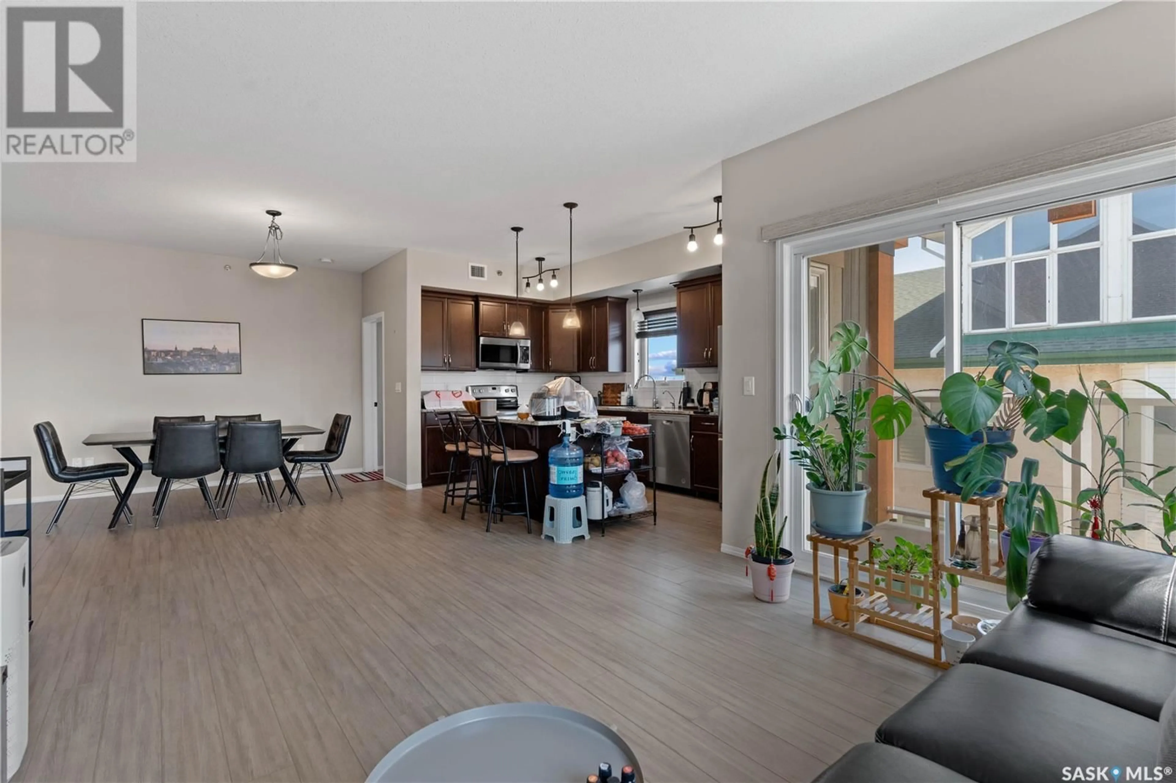 Open concept kitchen, wood/laminate floor for 1220 - 416 BLACKFOOT DRIVE, Regina Saskatchewan S4S6T2