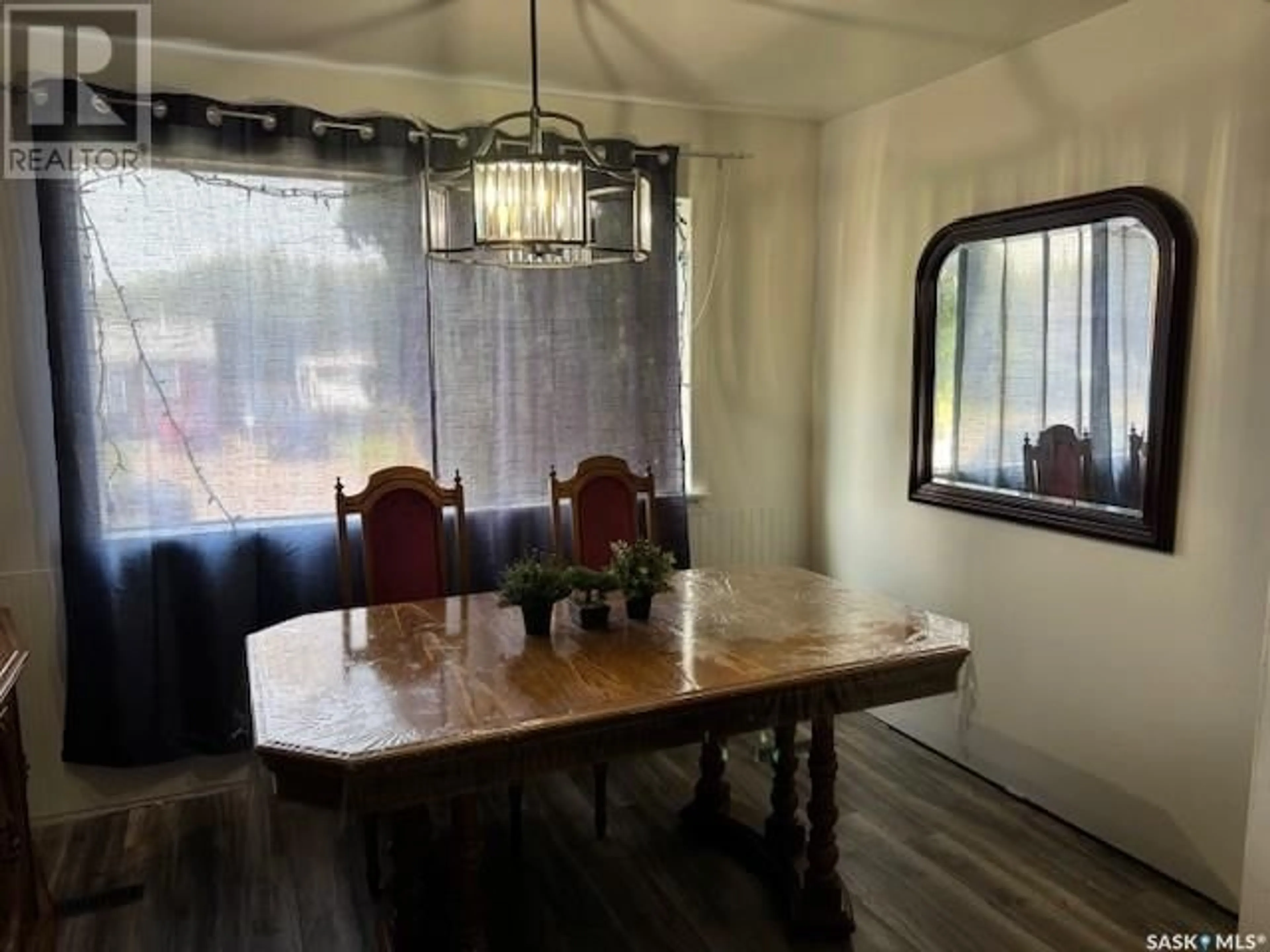 Dining room, wood/laminate floor for 1482 110TH STREET, North Battleford Saskatchewan S9A2J2