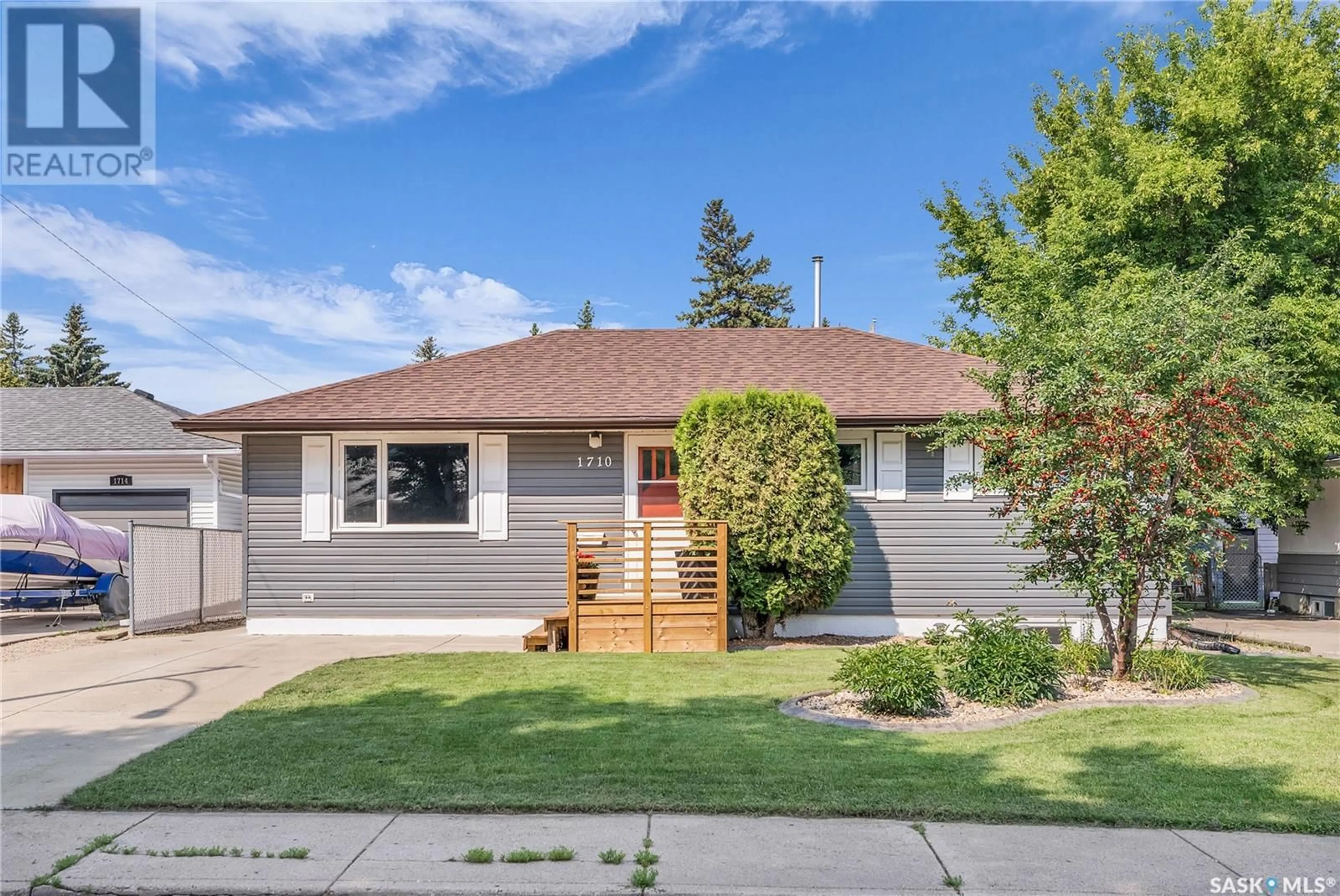 Home with vinyl exterior material, street for 1710 JACKSON AVENUE, Saskatoon Saskatchewan S7H2N6