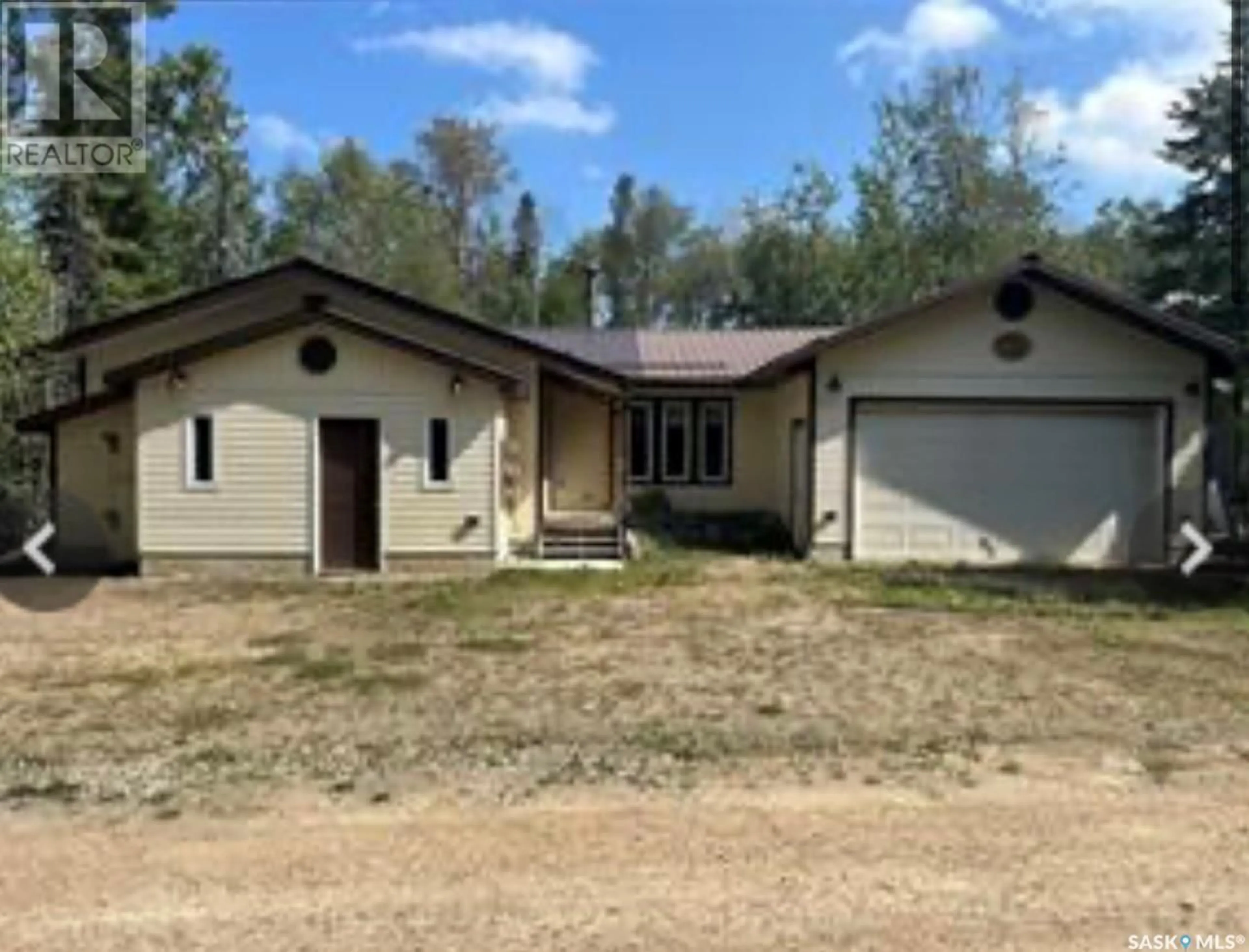 A pic from outside/outdoor area/front of a property/back of a property/a pic from drone, building for 513 TAMARACK PLACE, White Swan Lake Saskatchewan S0J2J0