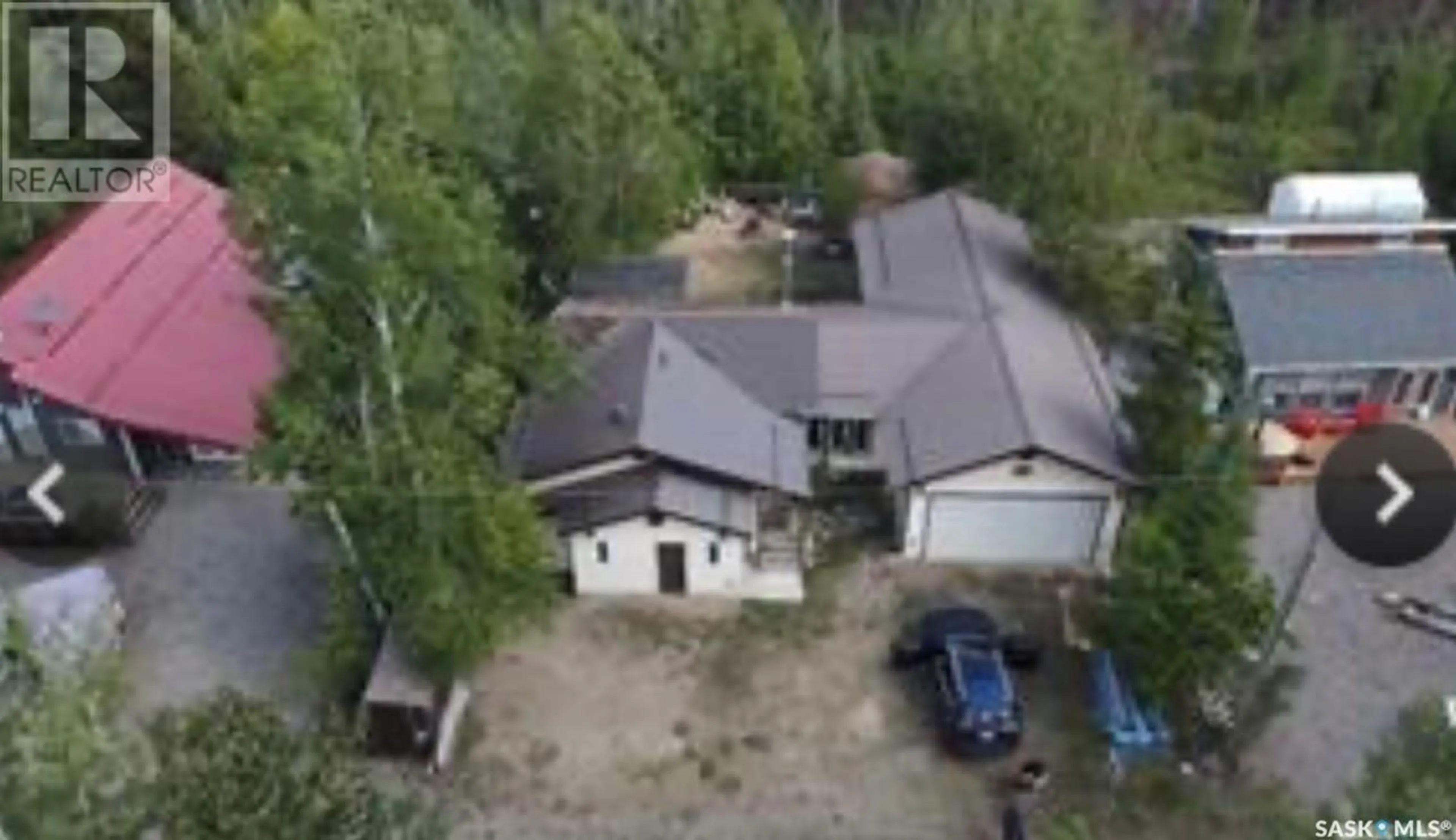 A pic from outside/outdoor area/front of a property/back of a property/a pic from drone, unknown for 513 TAMARACK PLACE, White Swan Lake Saskatchewan S0J2J0