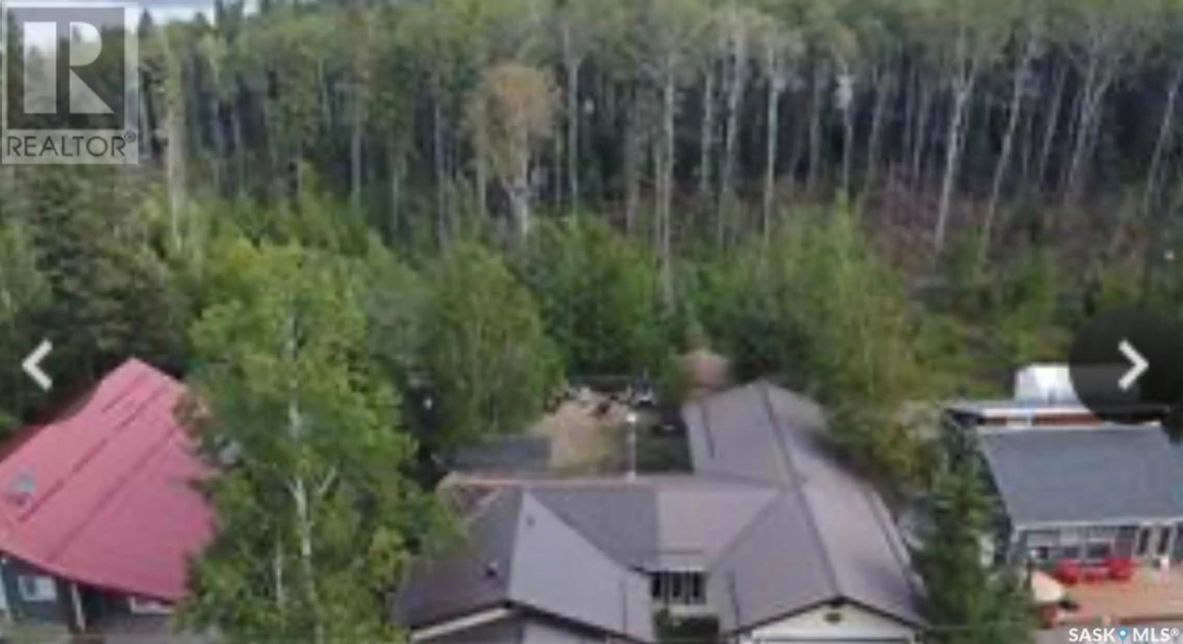 A pic from outside/outdoor area/front of a property/back of a property/a pic from drone, forest/trees view for 513 TAMARACK PLACE, White Swan Lake Saskatchewan S0J2J0