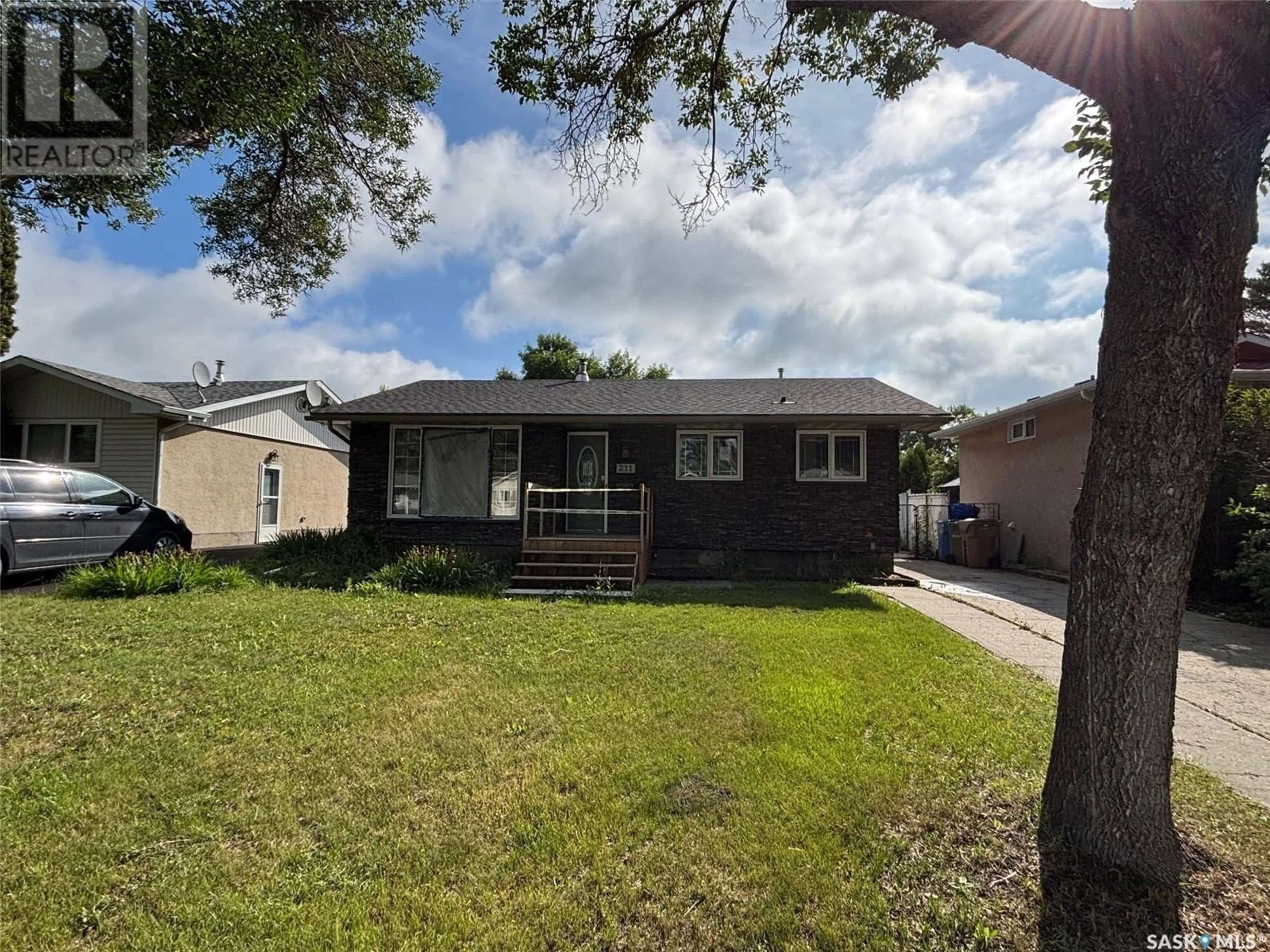 Home with vinyl exterior material, street for 211 UPLAND DRIVE, Regina Saskatchewan S4R6C6