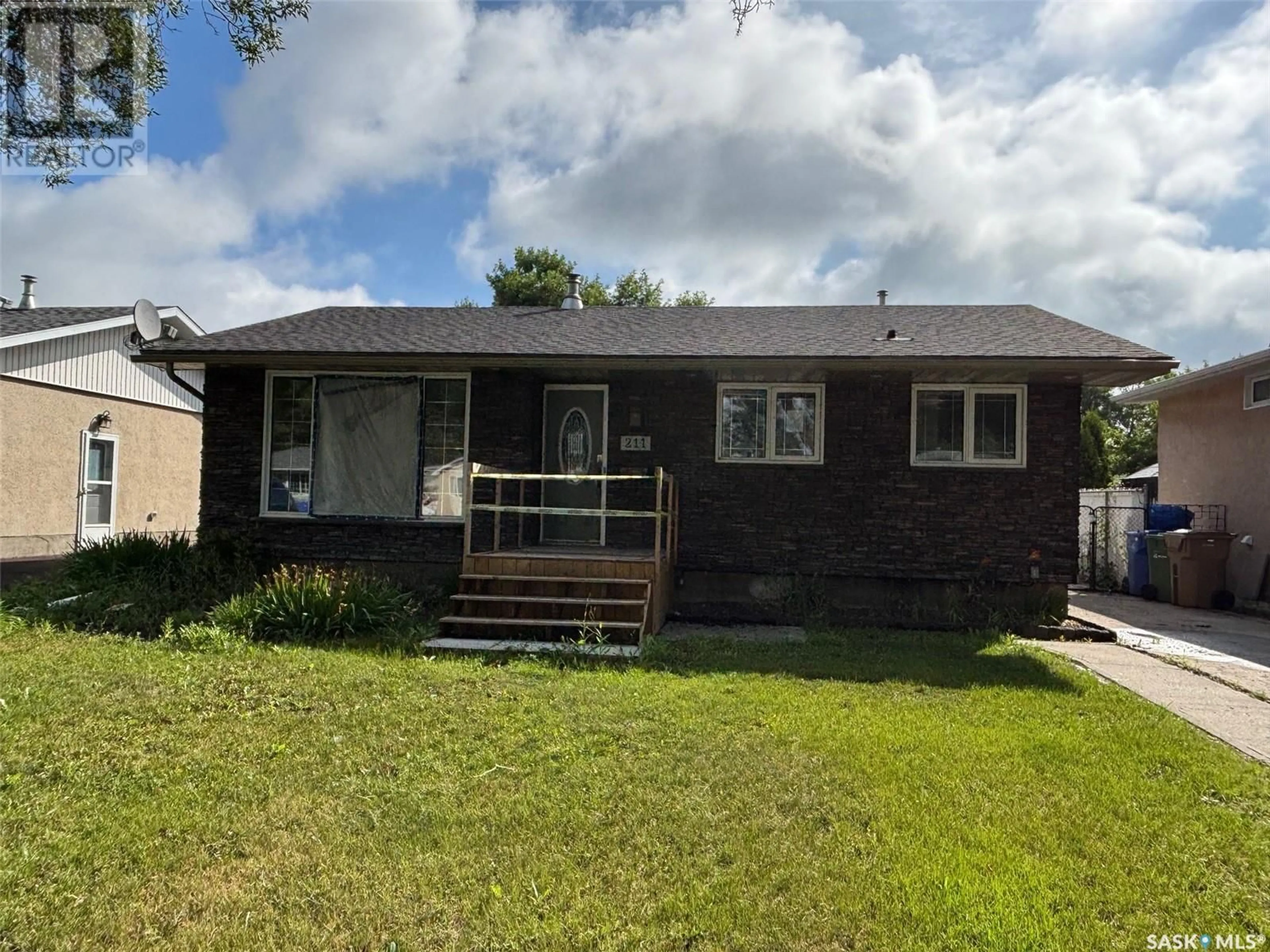 Home with vinyl exterior material, street for 211 UPLAND DRIVE, Regina Saskatchewan S4R6C6