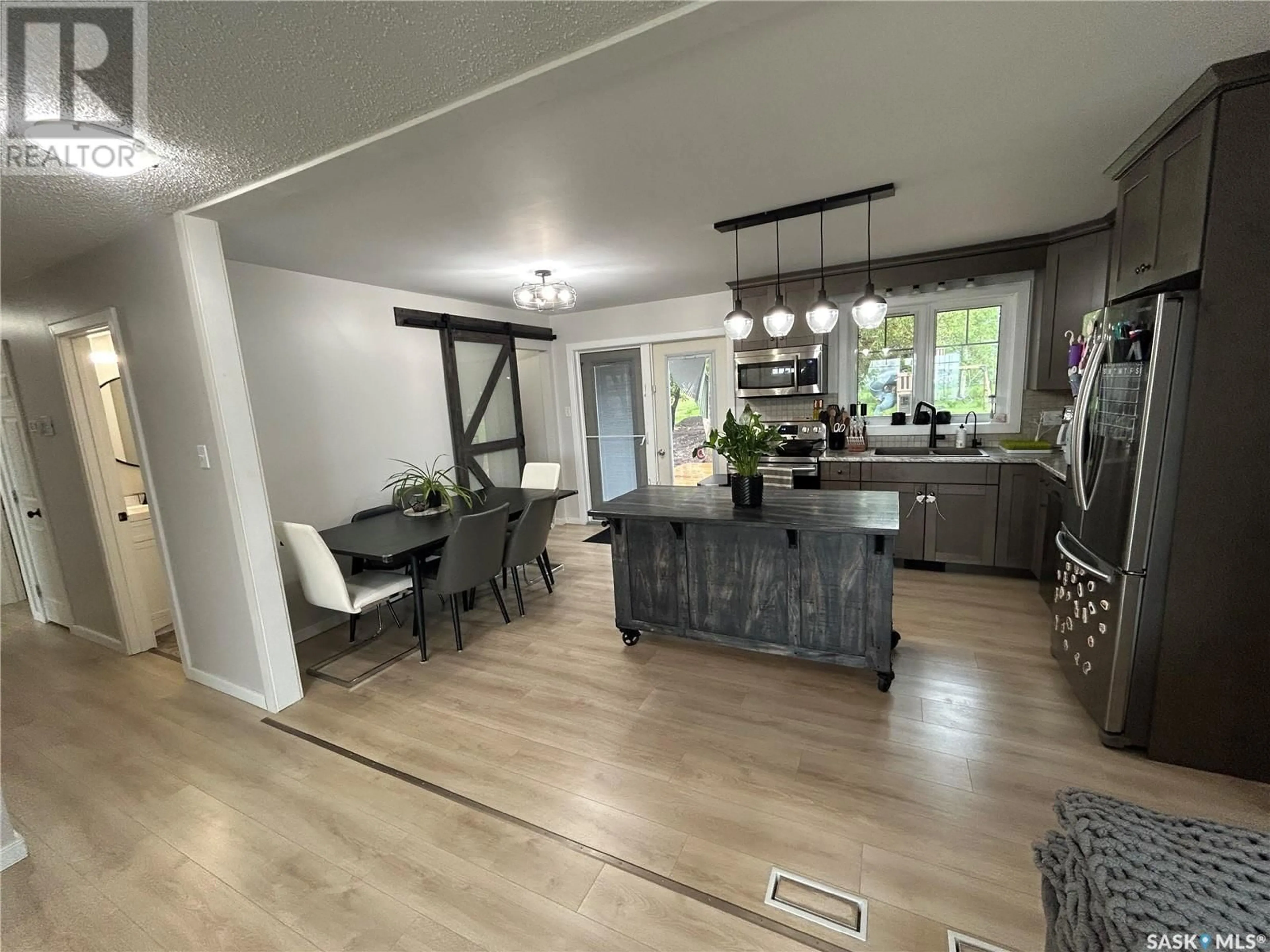 Open concept kitchen, wood/laminate floor for 114 3RD AVENUE, Maymont Saskatchewan S0M1T0