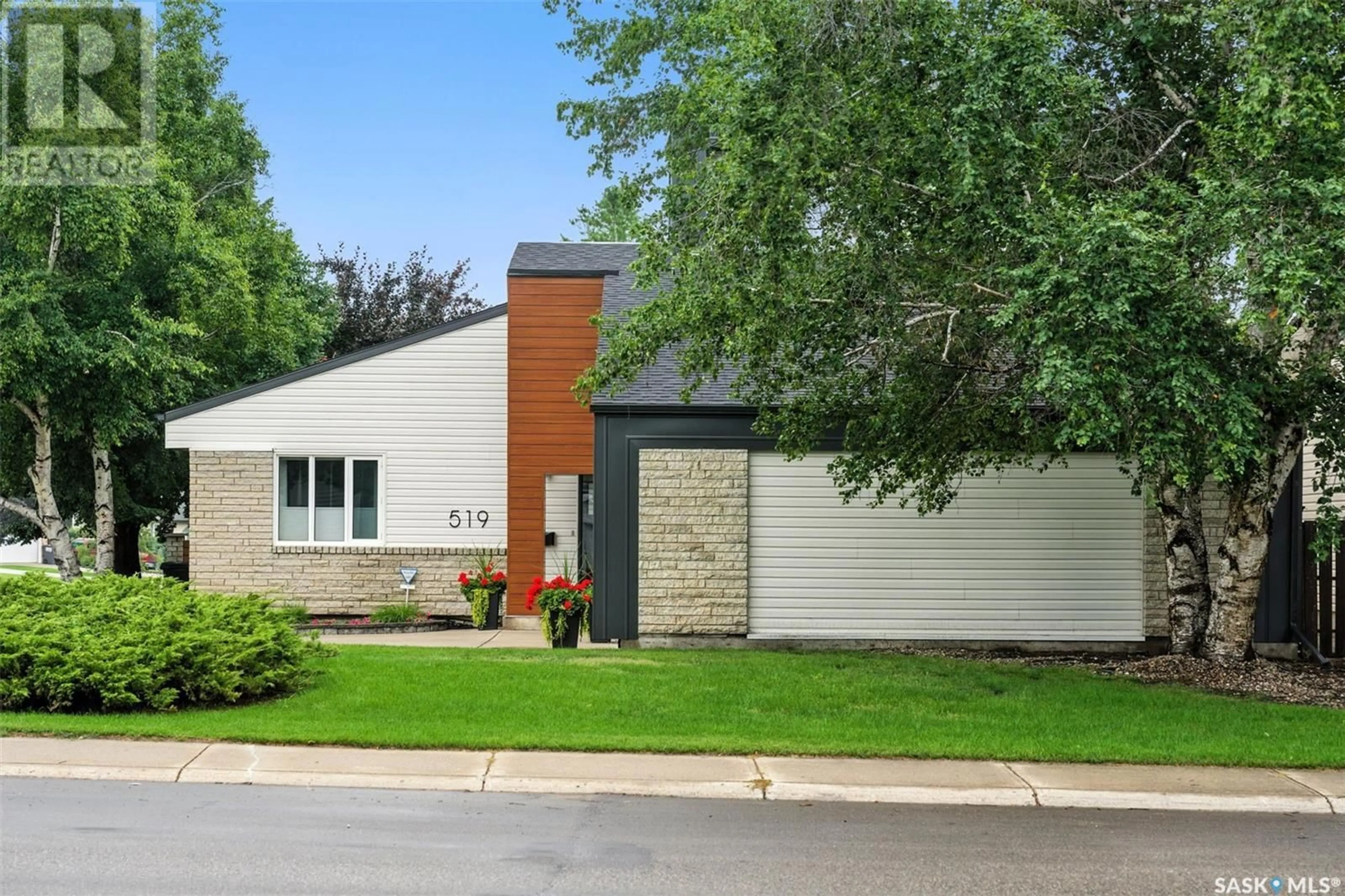 Home with brick exterior material, street for 519 SILVERWOOD ROAD, Saskatoon Saskatchewan S7K6X3