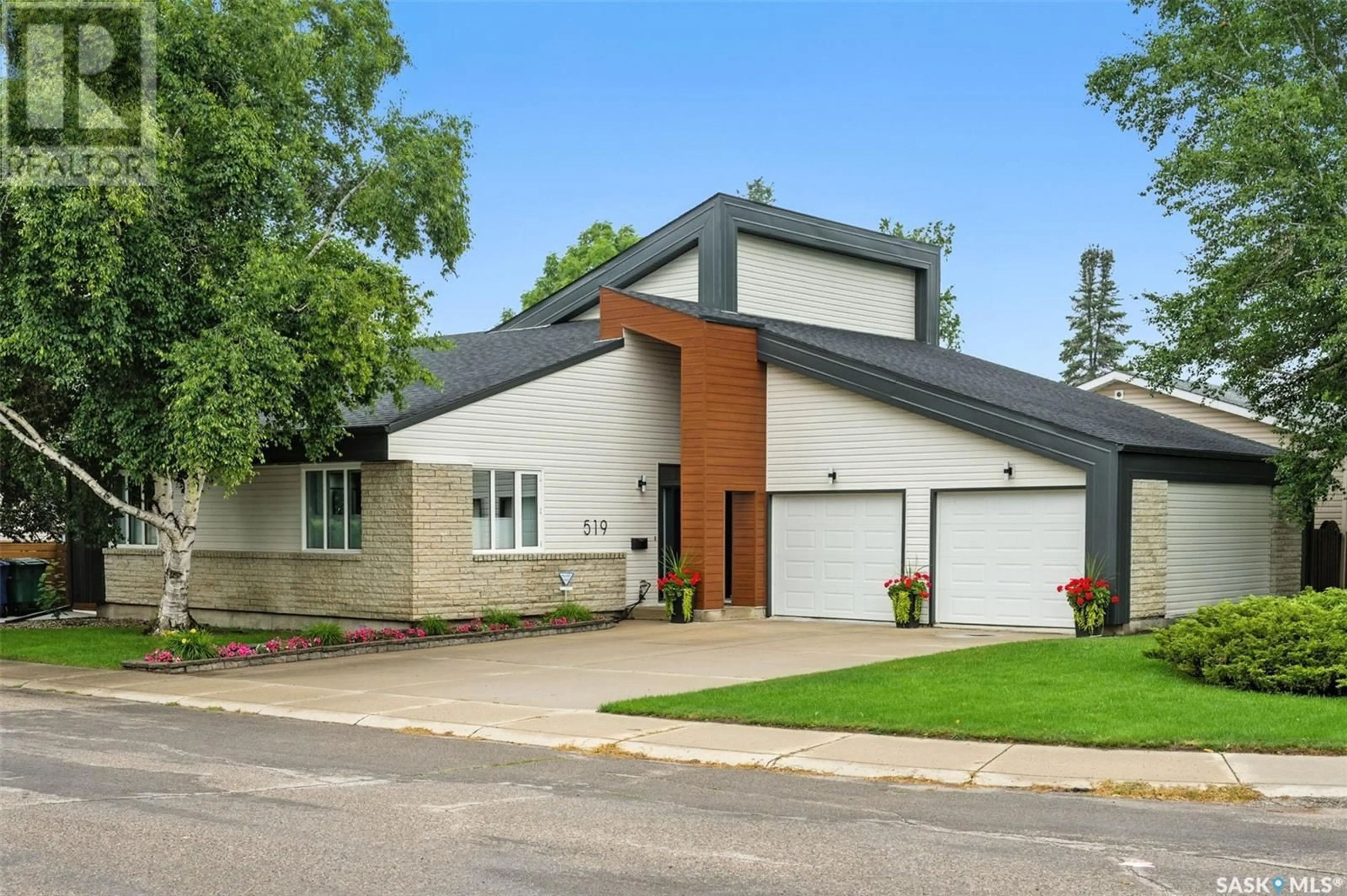 Home with brick exterior material, street for 519 SILVERWOOD ROAD, Saskatoon Saskatchewan S7K6X3