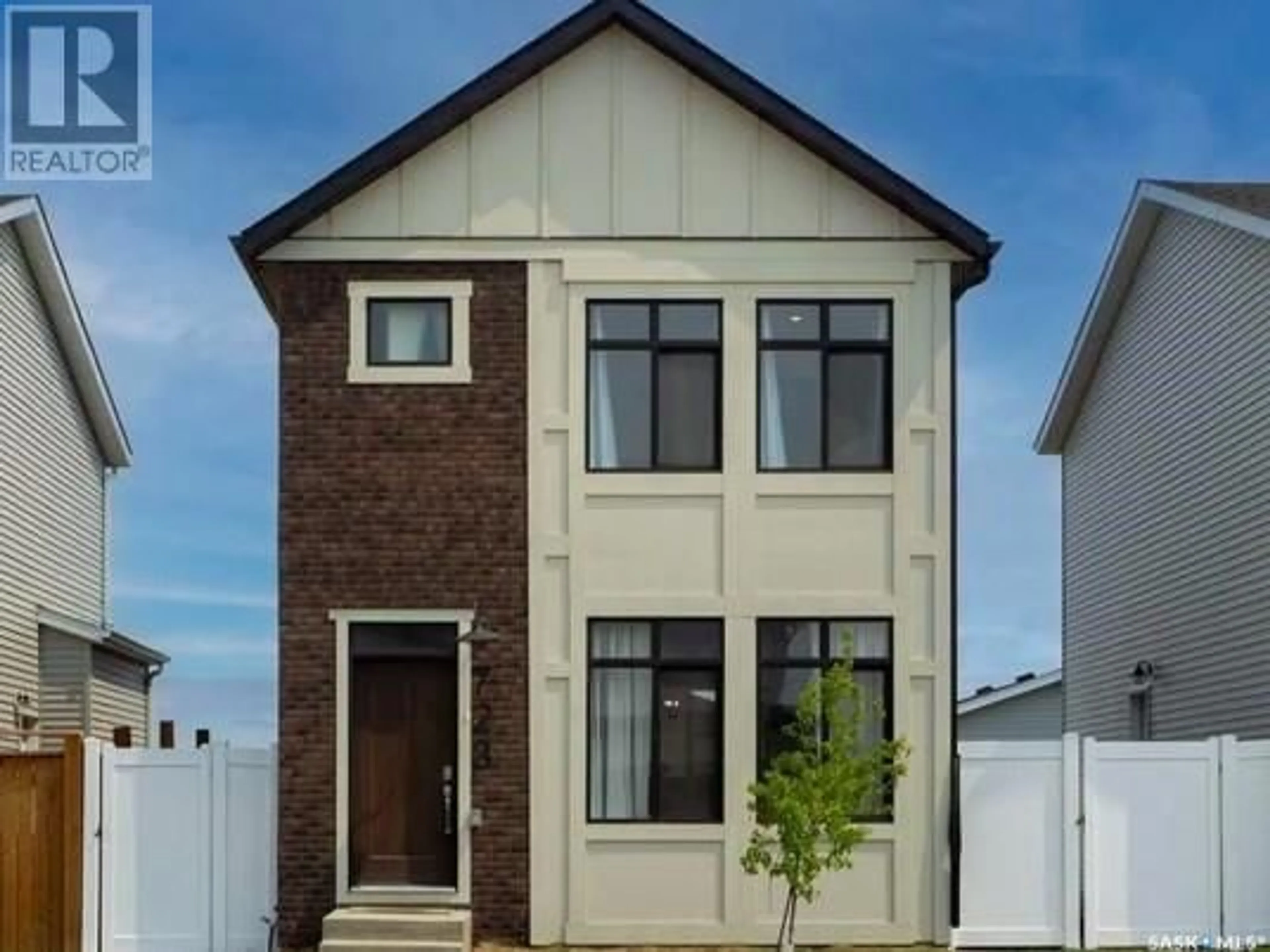 Home with brick exterior material, street for 723 HENRY DAYDAY ROAD, Saskatoon Saskatchewan S7W1H5