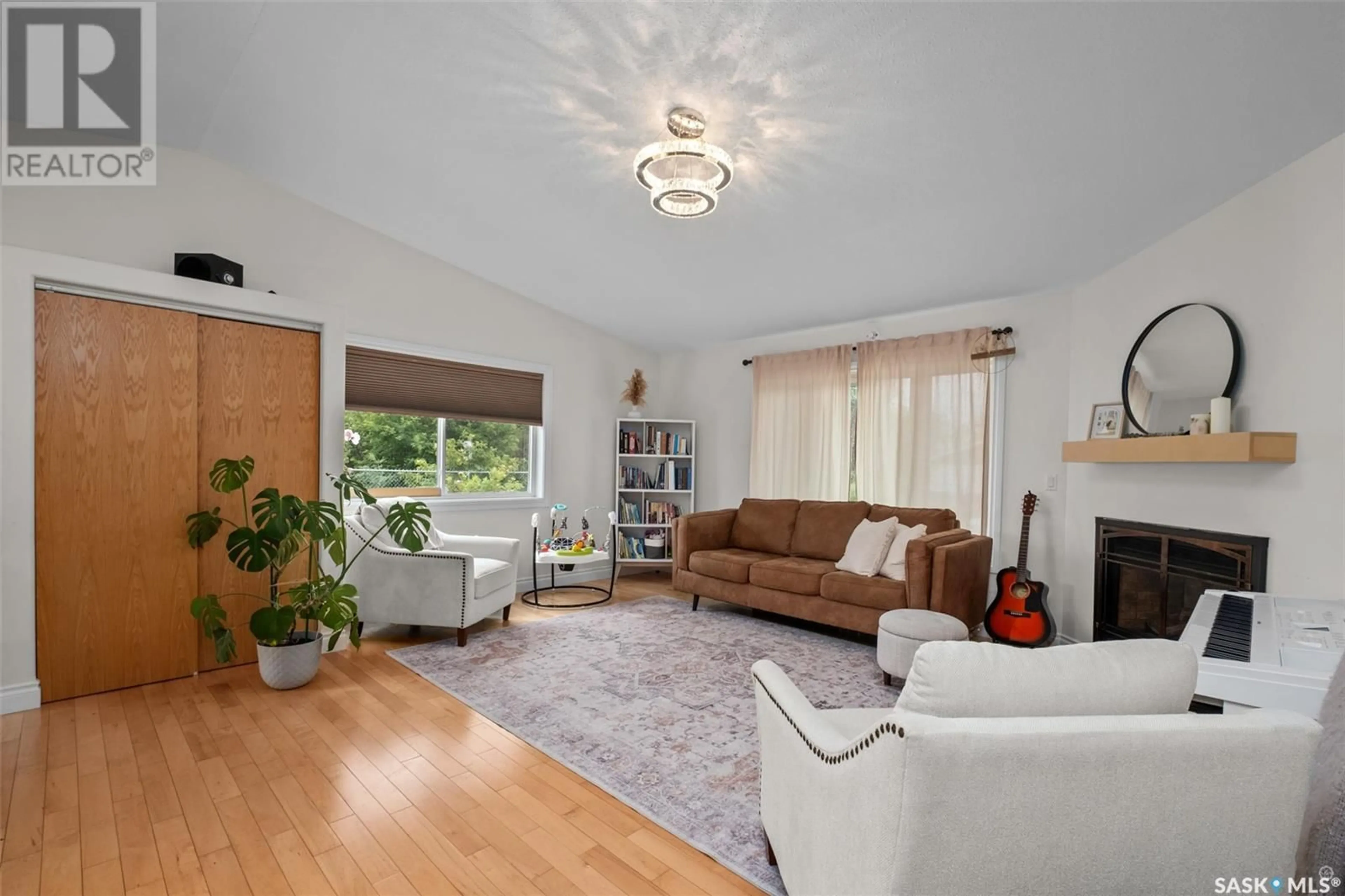 Living room with furniture, wood/laminate floor for 1255 18TH STREET, Prince Albert Saskatchewan S6V4B6
