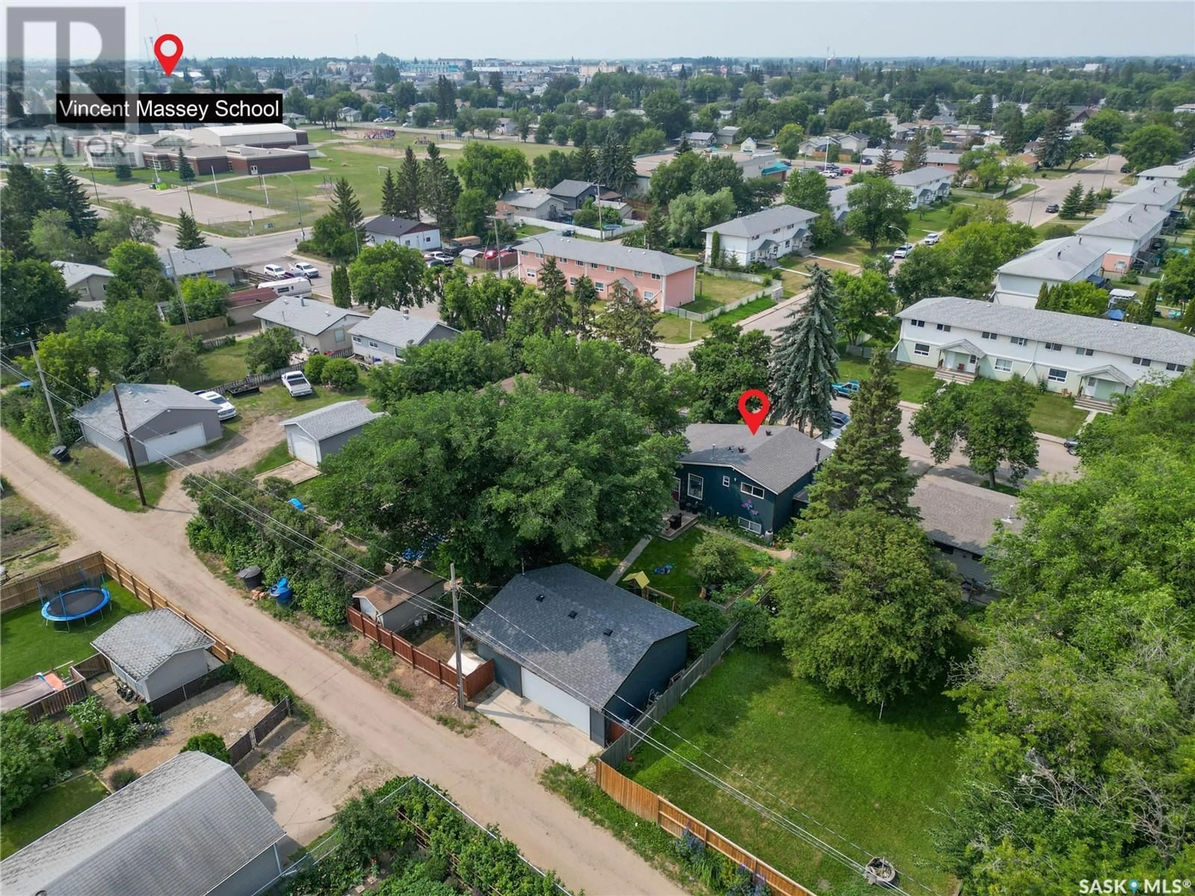 A pic from outside/outdoor area/front of a property/back of a property/a pic from drone, street for 2640 3RD AVENUE, Prince Albert Saskatchewan S6V2G4