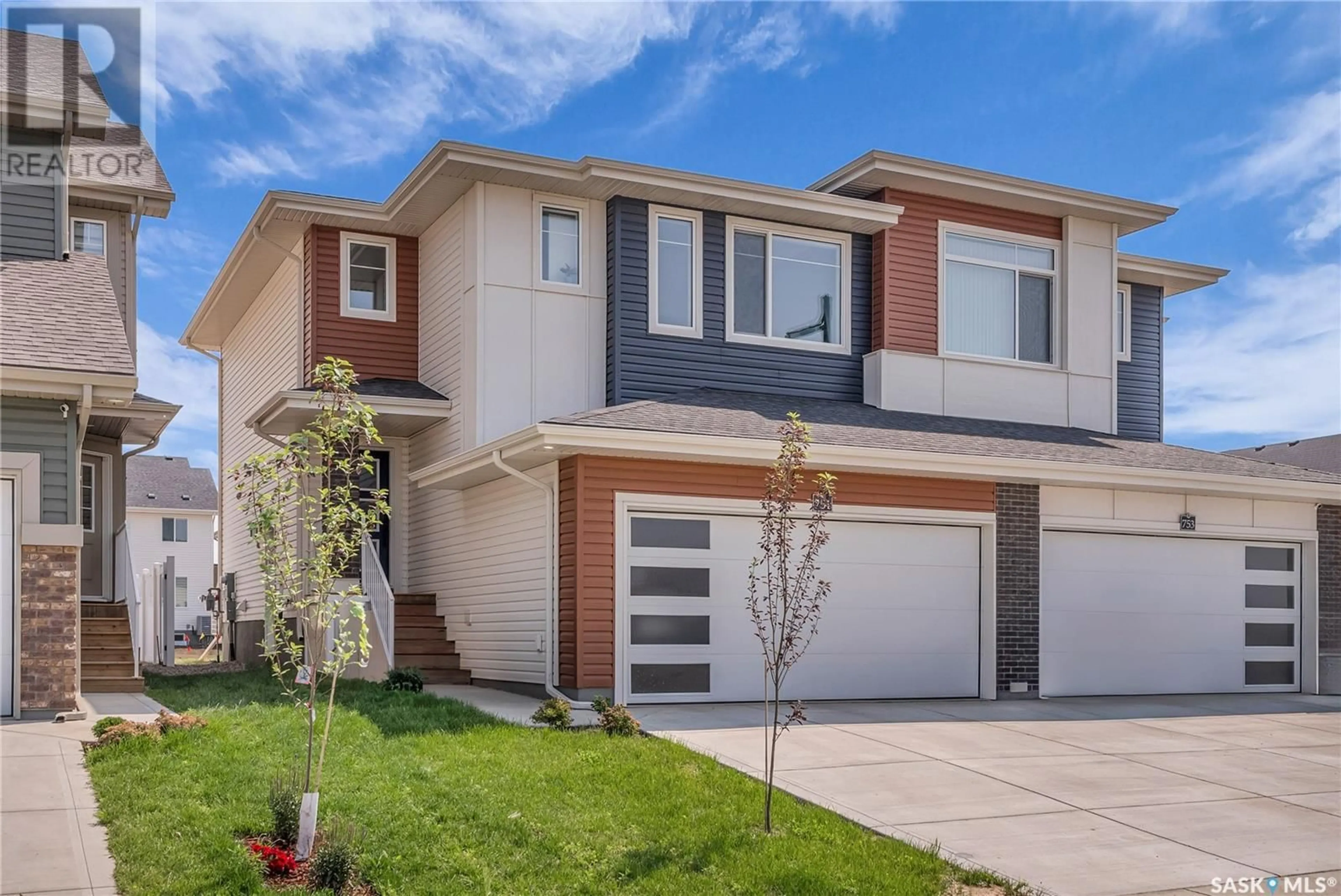 Home with brick exterior material, street for 751 BRIGHTON BOULEVARD, Saskatoon Saskatchewan S7V1P6