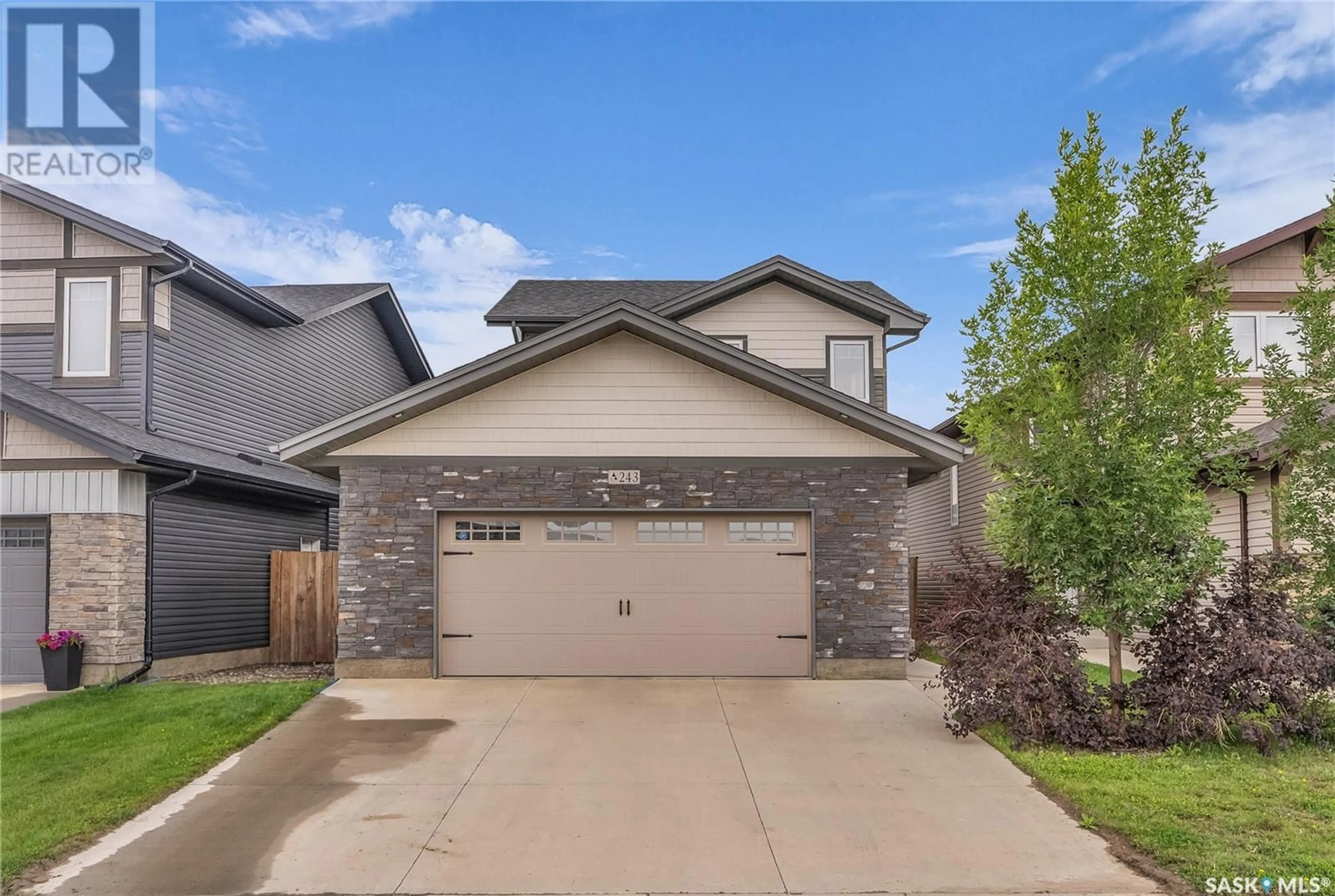 Home with brick exterior material, street for 243 UNDERHILL WAY, Saskatoon Saskatchewan S7V0M9