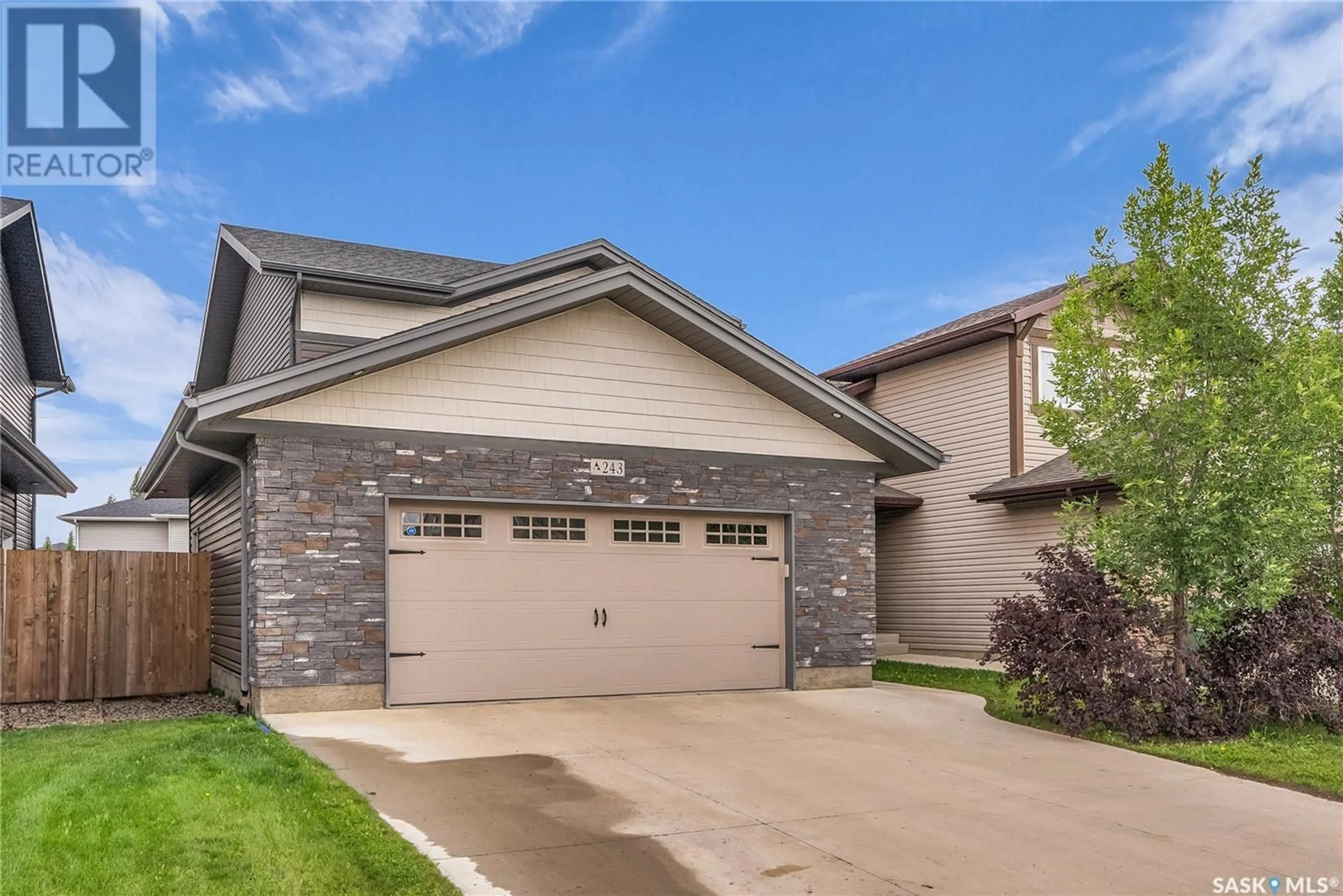 Home with brick exterior material, street for 243 UNDERHILL WAY, Saskatoon Saskatchewan S7V0M9