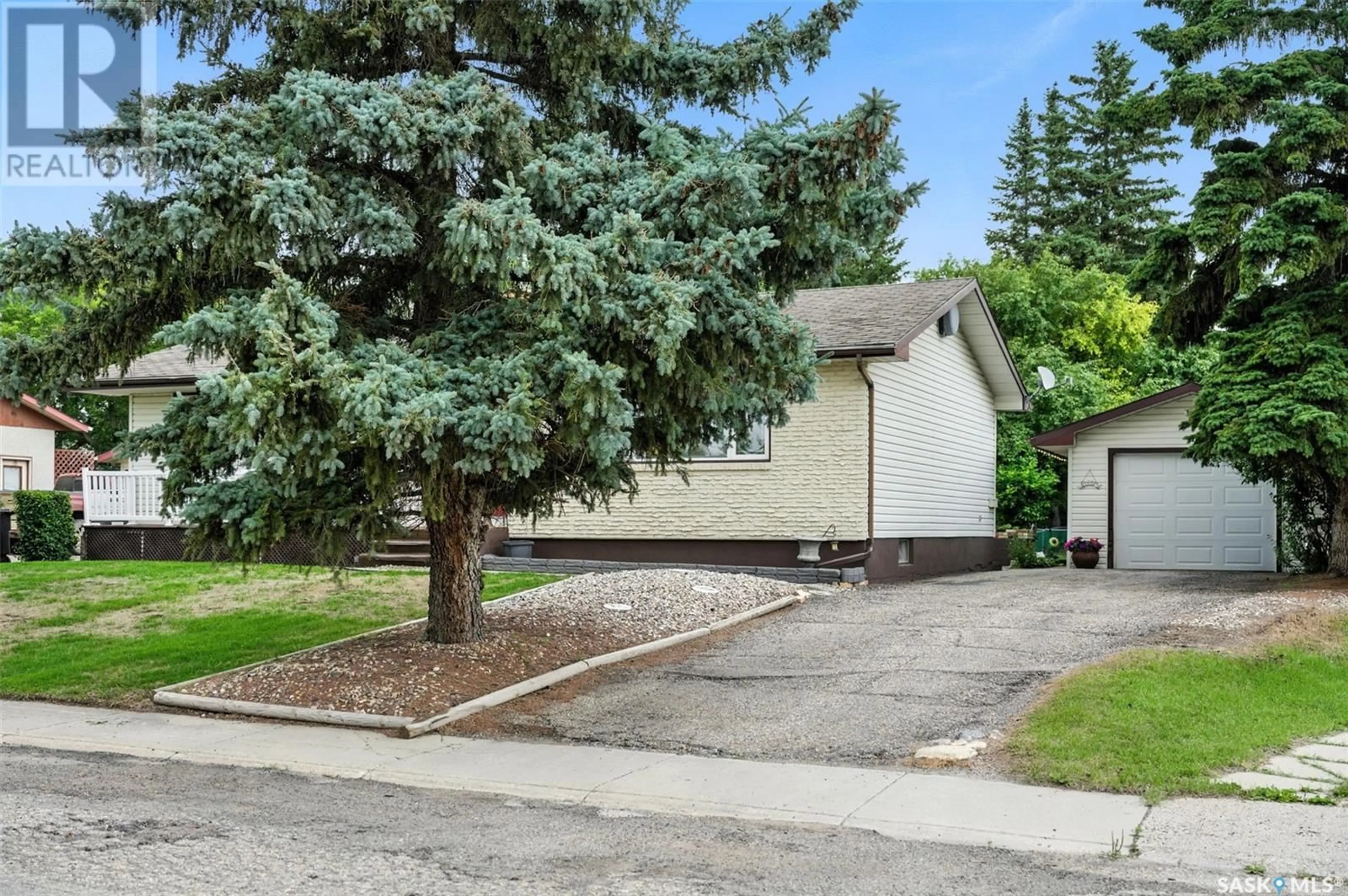 Home with vinyl exterior material, street for 42 CALVERT CRESCENT, Lanigan Saskatchewan S0K2M0