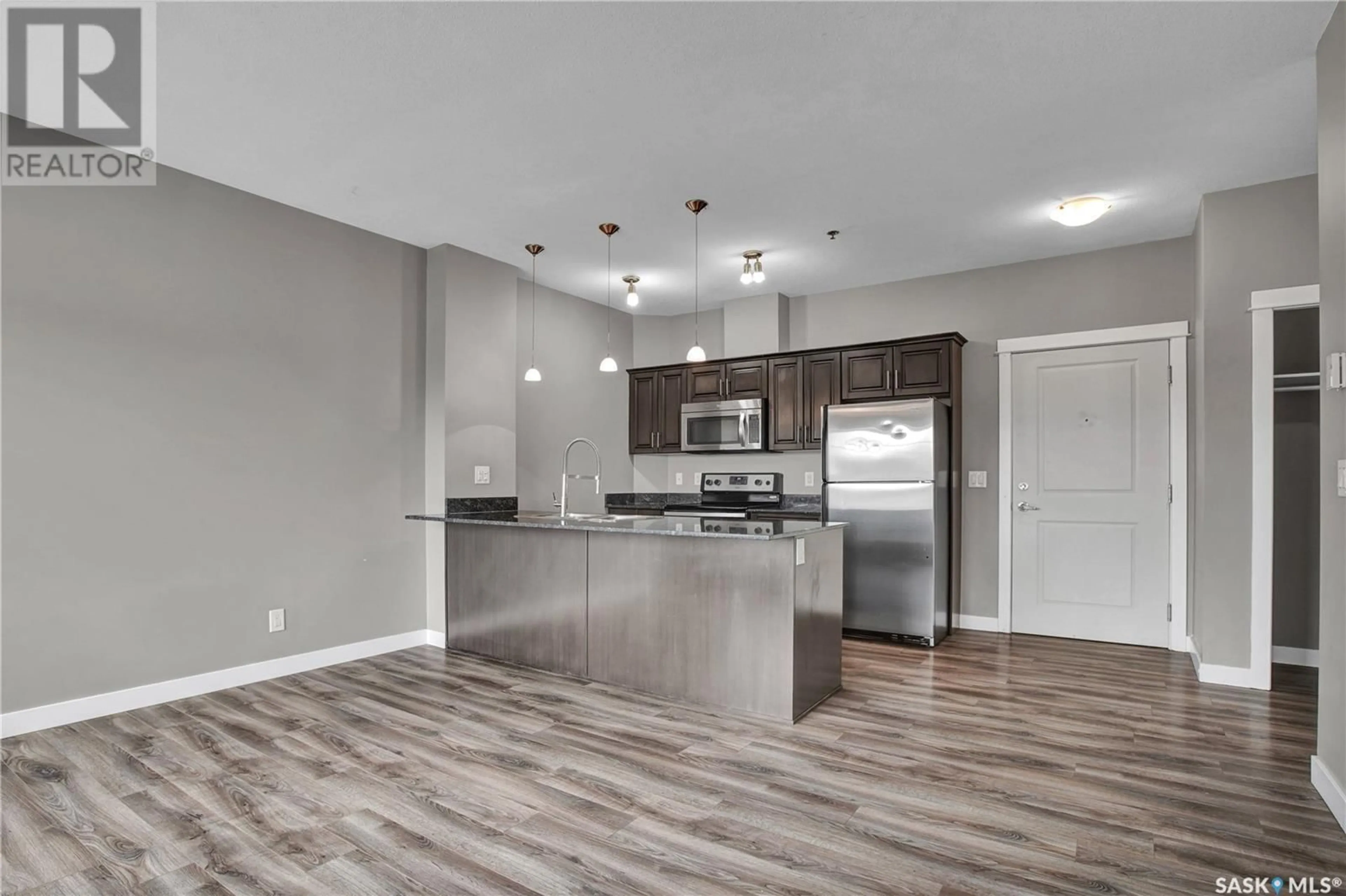 Open concept kitchen, wood/laminate floor for 702 - 304 HART ROAD, Saskatoon Saskatchewan S7M4P4