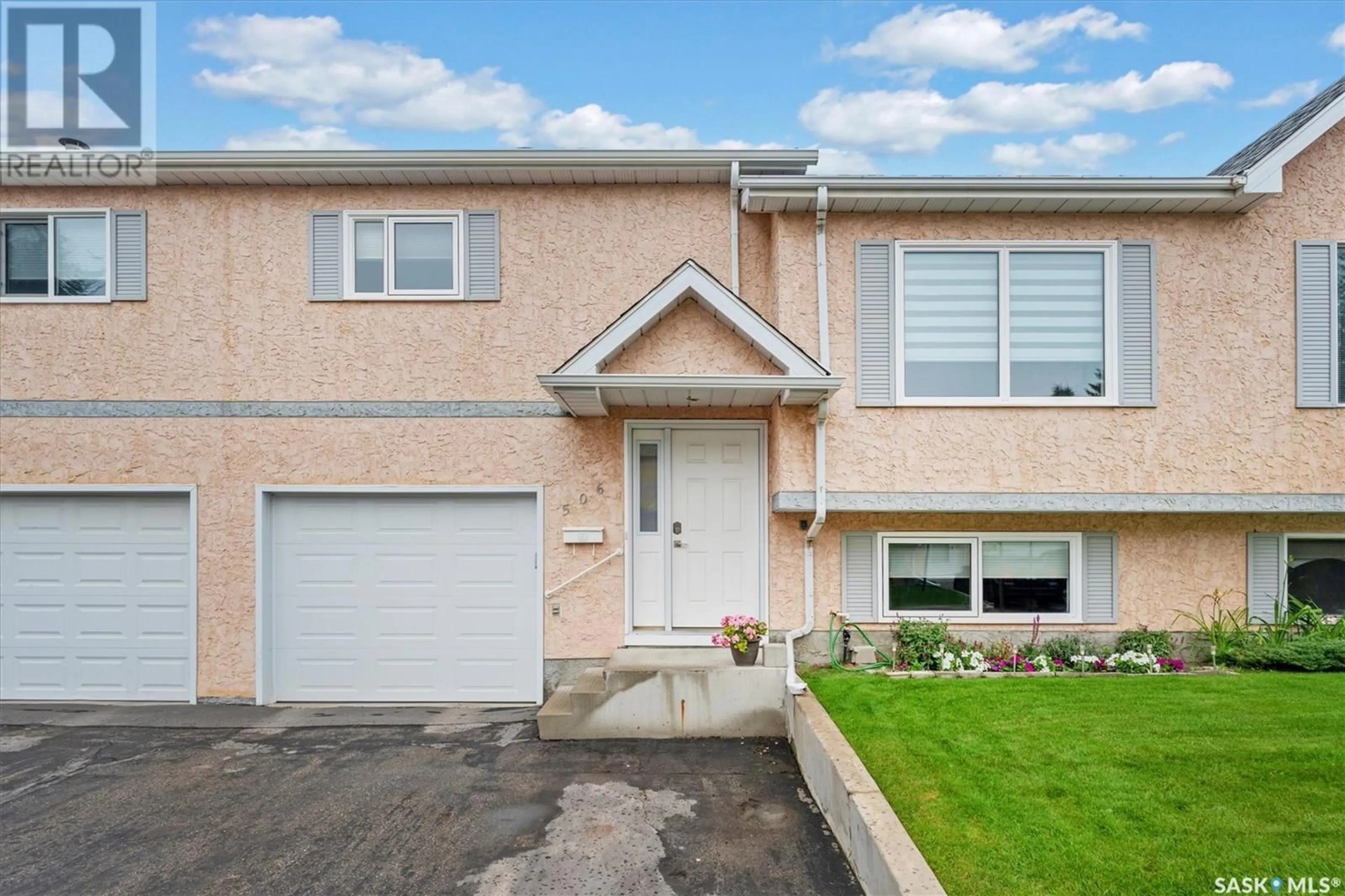 Home with vinyl exterior material, street for 506 510 PEREHUDOFF CRESCENT, Saskatoon Saskatchewan S7N4H6