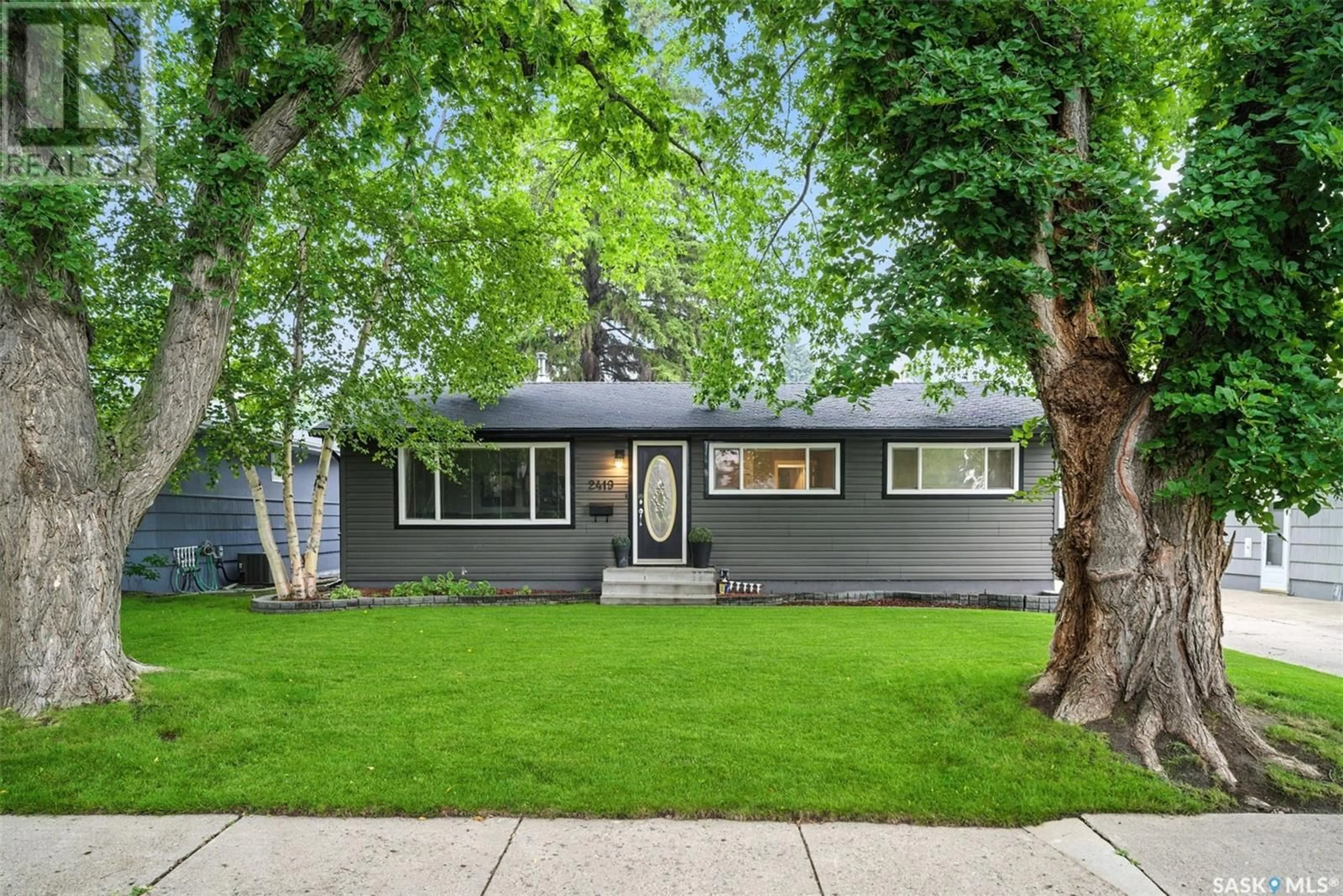 Home with vinyl exterior material, street for 2419 DUFFERIN AVENUE, Saskatoon Saskatchewan S7J1C3