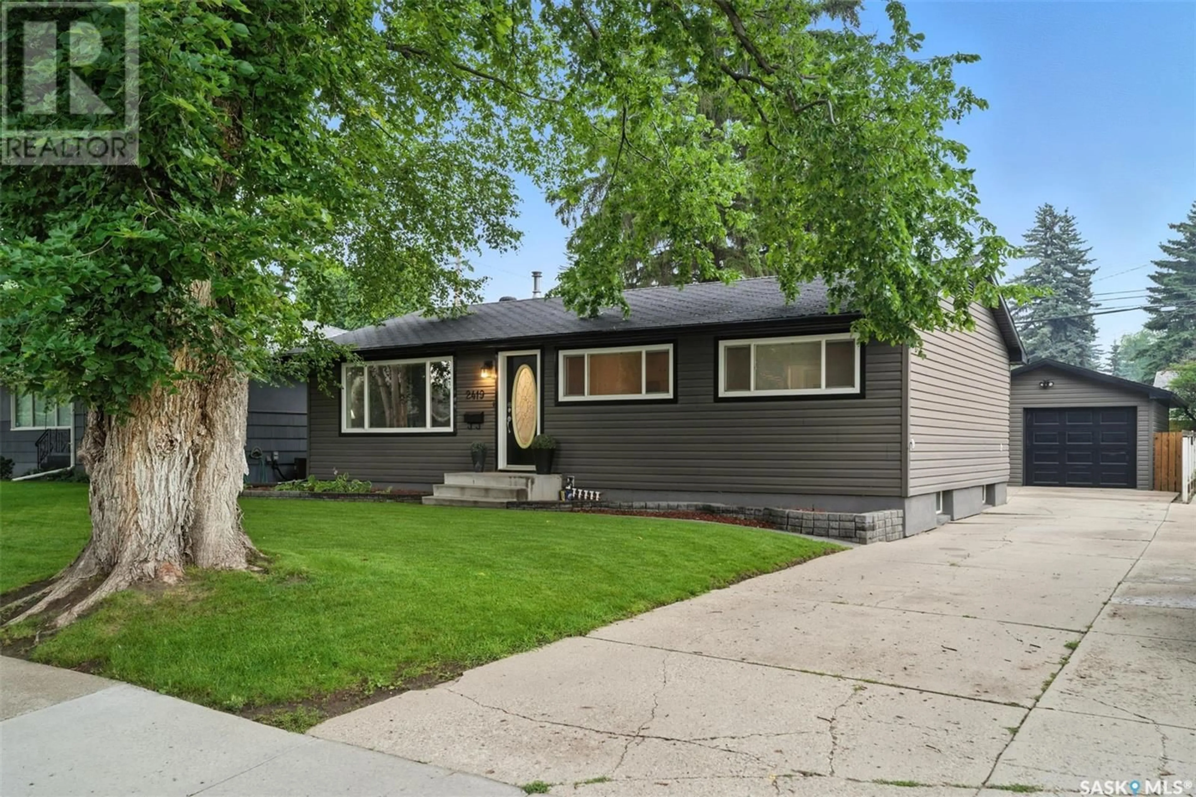 Home with vinyl exterior material, street for 2419 DUFFERIN AVENUE, Saskatoon Saskatchewan S7J1C3