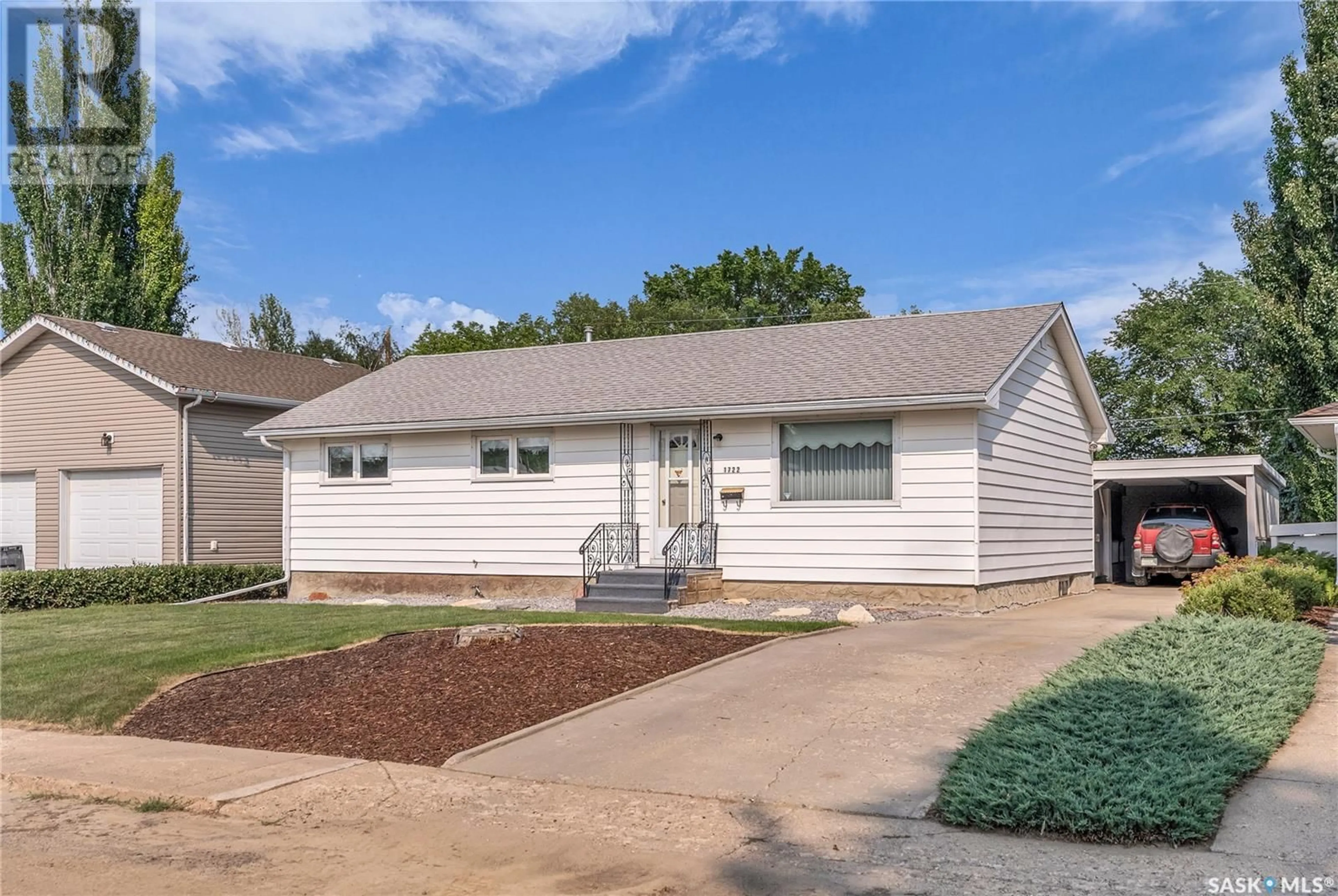Home with vinyl exterior material, street for 1722 93RD STREET, North Battleford Saskatchewan S9A0C8
